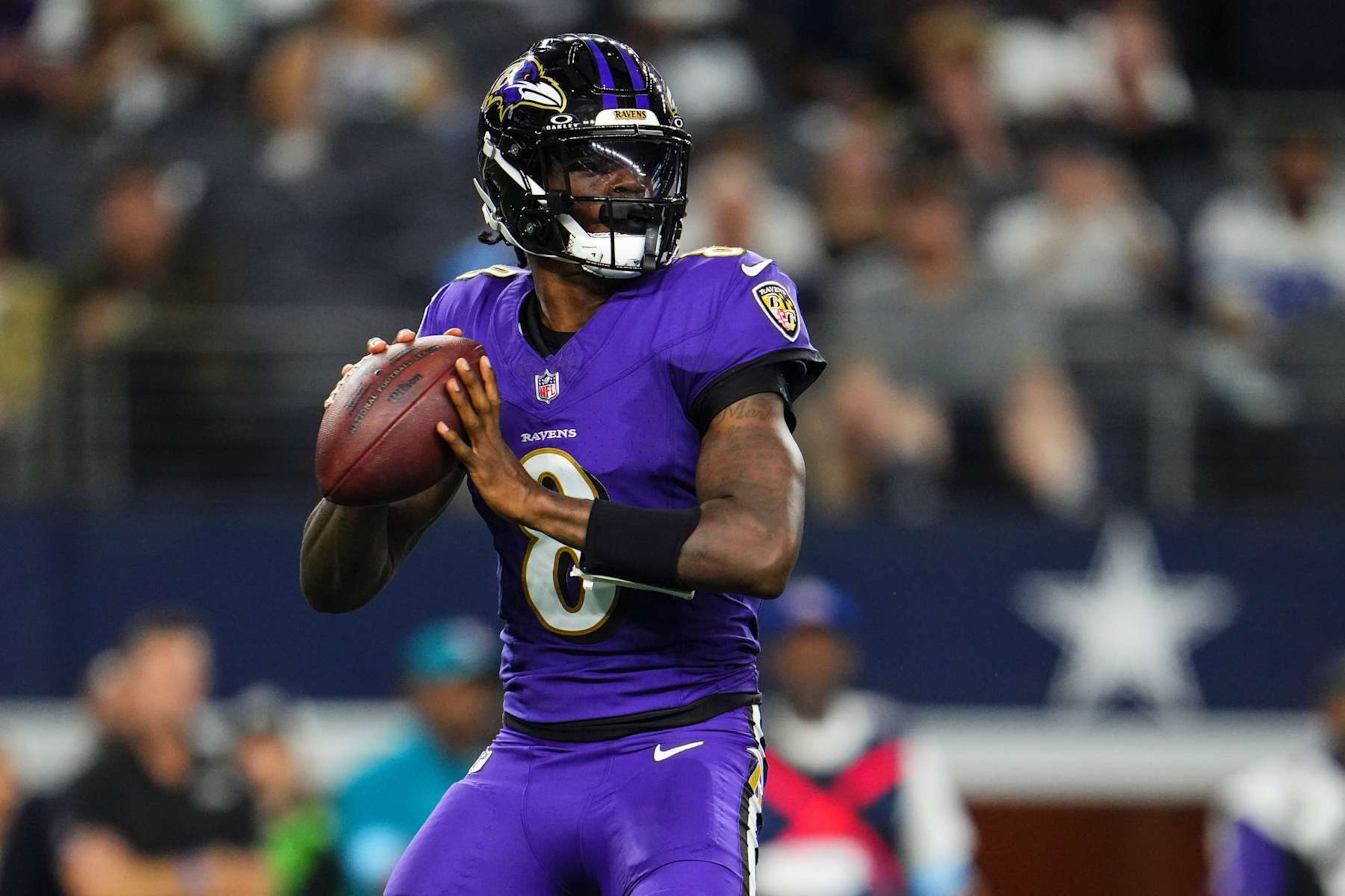 ARLINGTON, TX - SEPTEMBER 22: Lamar Jackson #8 of the Baltimore Ravens throws the ball during an NFL football game against the Dallas Cowboys at AT&T Stadium on September 22, 2024 in Arlington, Texas. (Photo by Cooper Neill/Getty Images)