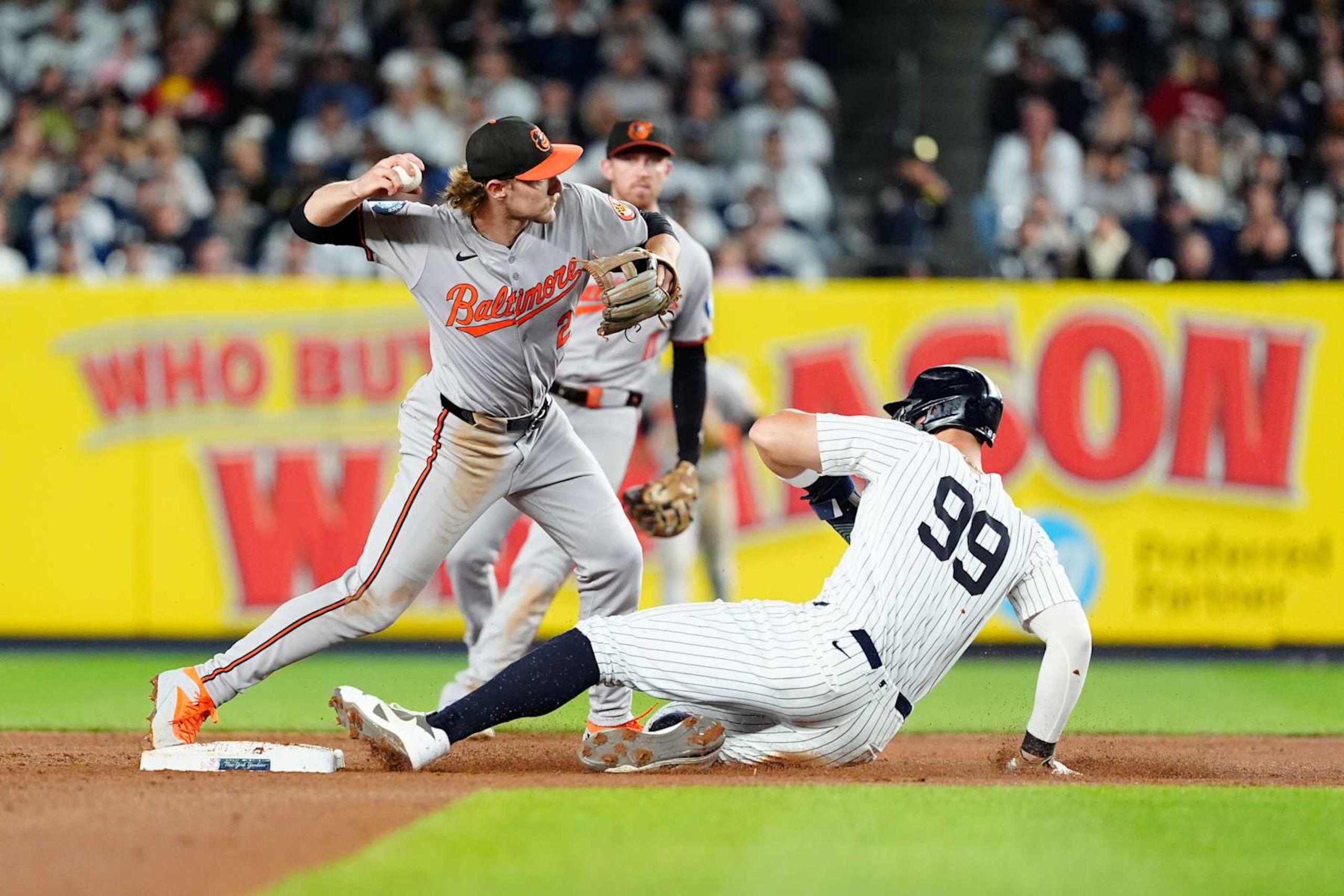 Gunnar Henderson turns a double play over a sliding Aaron Judge Gunnar Henderson turns a double play over a sliding Aaron Judge