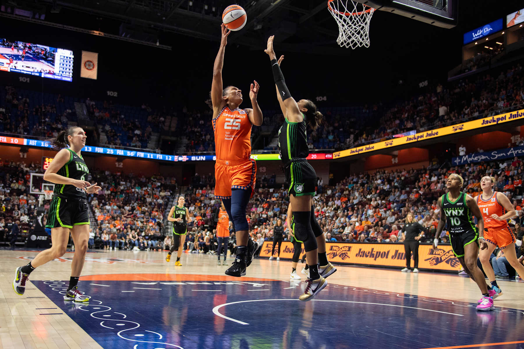 UNCASVILLE, CT - SEPTEMBER 17: Connecticut Sun forward Alyssa Thomas (25) shoots the ball while defended by Minnesota Lynx forward Napheesa Collier (24) during a WNBA game between the Minnesota Lynx and the Connecticut Sun on September 17,2024, at Mohegan Sun Arena in Uncasville, CT. (Photo by Erica Denhoff/Icon Sportswire via Getty Images)