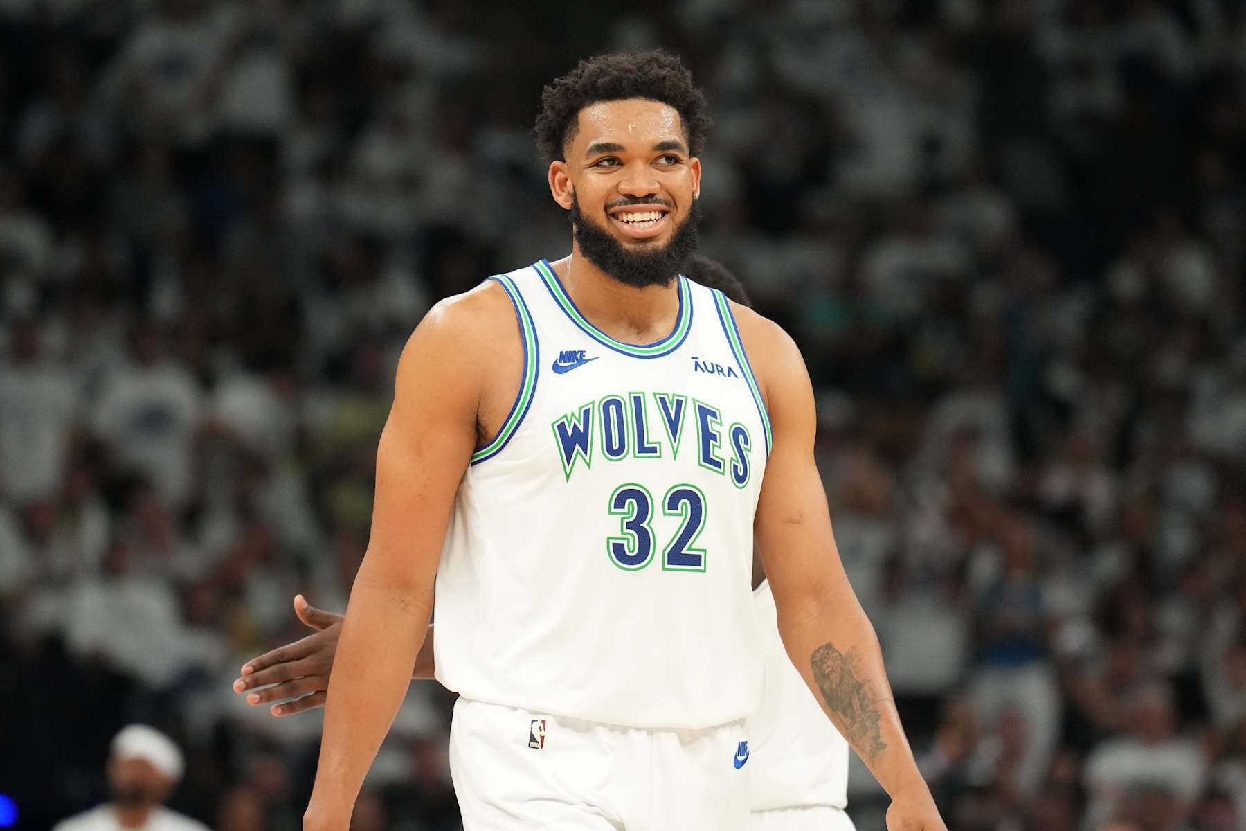 MINNEAPOLIS, MN -  MAY 24: Karl-Anthony Towns #32 of the Minnesota Timberwolves smiles during the game against the Dallas Mavericks during Game 2 of the Western Conference Finals of the 2024 NBA Playoffs on February 24, 2024 at Target Center in Minneapolis, Minnesota. NOTE TO USER: User expressly acknowledges and agrees that, by downloading and or using this Photograph, user is consenting to the terms and conditions of the Getty Images License Agreement. Mandatory Copyright Notice: Copyright 2024 NBAE (Photo by Jesse D. Garrabrant/NBAE via Getty Images)