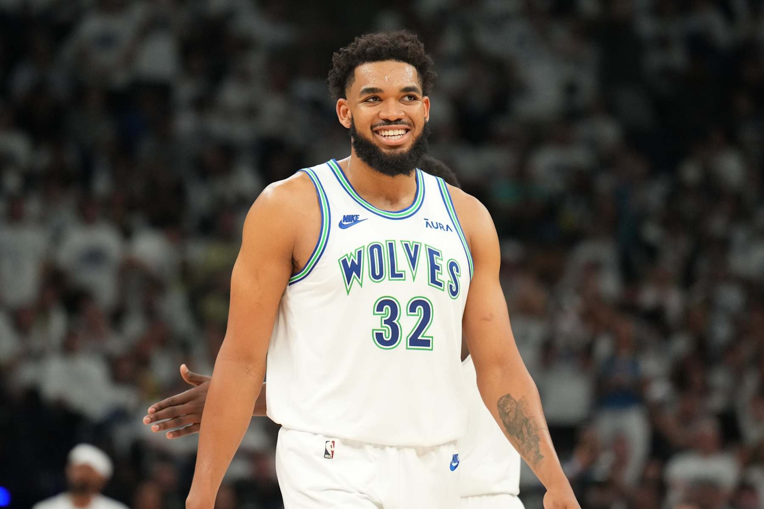 MINNEAPOLIS, MN -  MAY 24: Karl-Anthony Towns #32 of the Minnesota Timberwolves smiles during the game against the Dallas Mavericks during Game 2 of the Western Conference Finals of the 2024 NBA Playoffs on February 24, 2024 at Target Center in Minneapolis, Minnesota. NOTE TO USER: User expressly acknowledges and agrees that, by downloading and or using this Photograph, user is consenting to the terms and conditions of the Getty Images License Agreement. Mandatory Copyright Notice: Copyright 2024 NBAE (Photo by Jesse D. Garrabrant/NBAE via Getty Images)