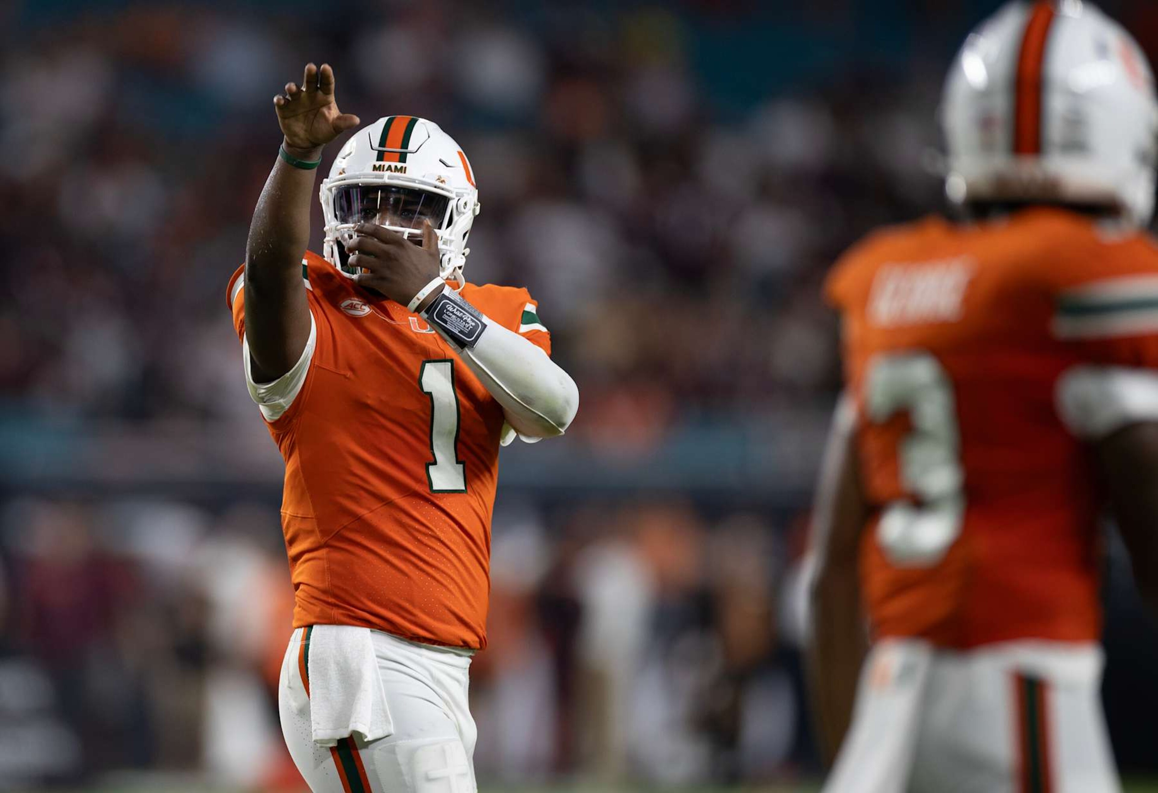 MIAMI GARDENS, FLORIDA - SEPTEMBER 27: Cam Ward #1 of the Miami Hurricanes celebrates with the team after scoring a touchdown during the game against the Virginia Tech Hokies at Hard Rock Stadium on September 27, 2024 in Miami Gardens, Florida. (Photo by Michael Pimentel/ISI Photos/Getty Images) MIAMI GARDENS, FLORIDA - SEPTEMBER 27: Cam Ward #1 of the Miami Hurricanes celebrates with the team after scoring a touchdown during the game against the Virginia Tech Hokies at Hard Rock Stadium on September 27, 2024 in Miami Gardens, Florida. (Photo by Michael Pimentel/ISI Photos/Getty Images)