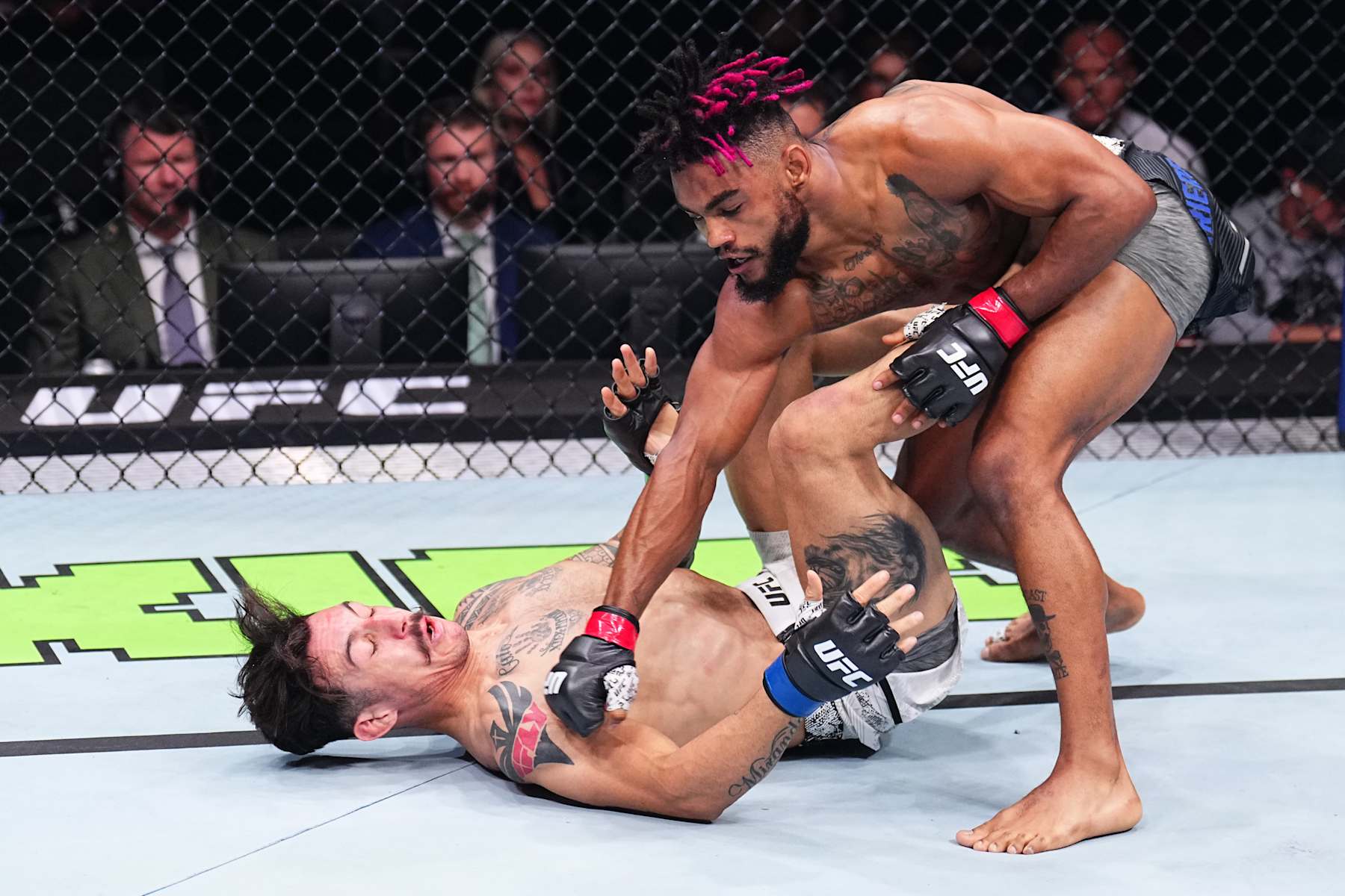 PARIS, FRANCE - SEPTEMBER 28: (R-L) Morgan Charriere of France punches Gabriel Miranda of Brazil in a featherweight fight during the UFC Fight Night event at The Accor Arena on September 28, 2024 in Paris, France.  (Photo by Chris Unger/Zuffa LLC)