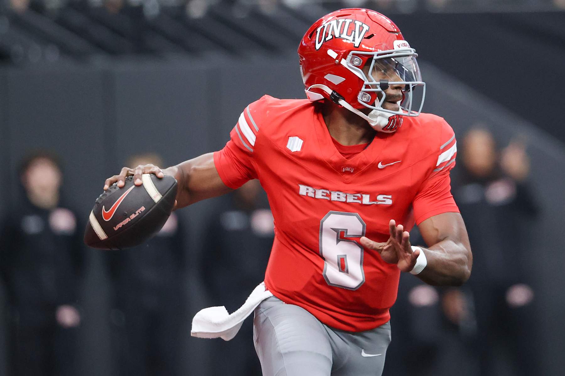 LAS VEGAS, NEVADA - SEPTEMBER 28: Hajj-Malik Williams #6 of the UNLV Rebels attempts a pass during the first quarter of a game against the Fresno State Bulldogs at Allegiant Stadium on September 28, 2024 in Las Vegas, Nevada.  (Photo by Ian Maule/Getty Images)