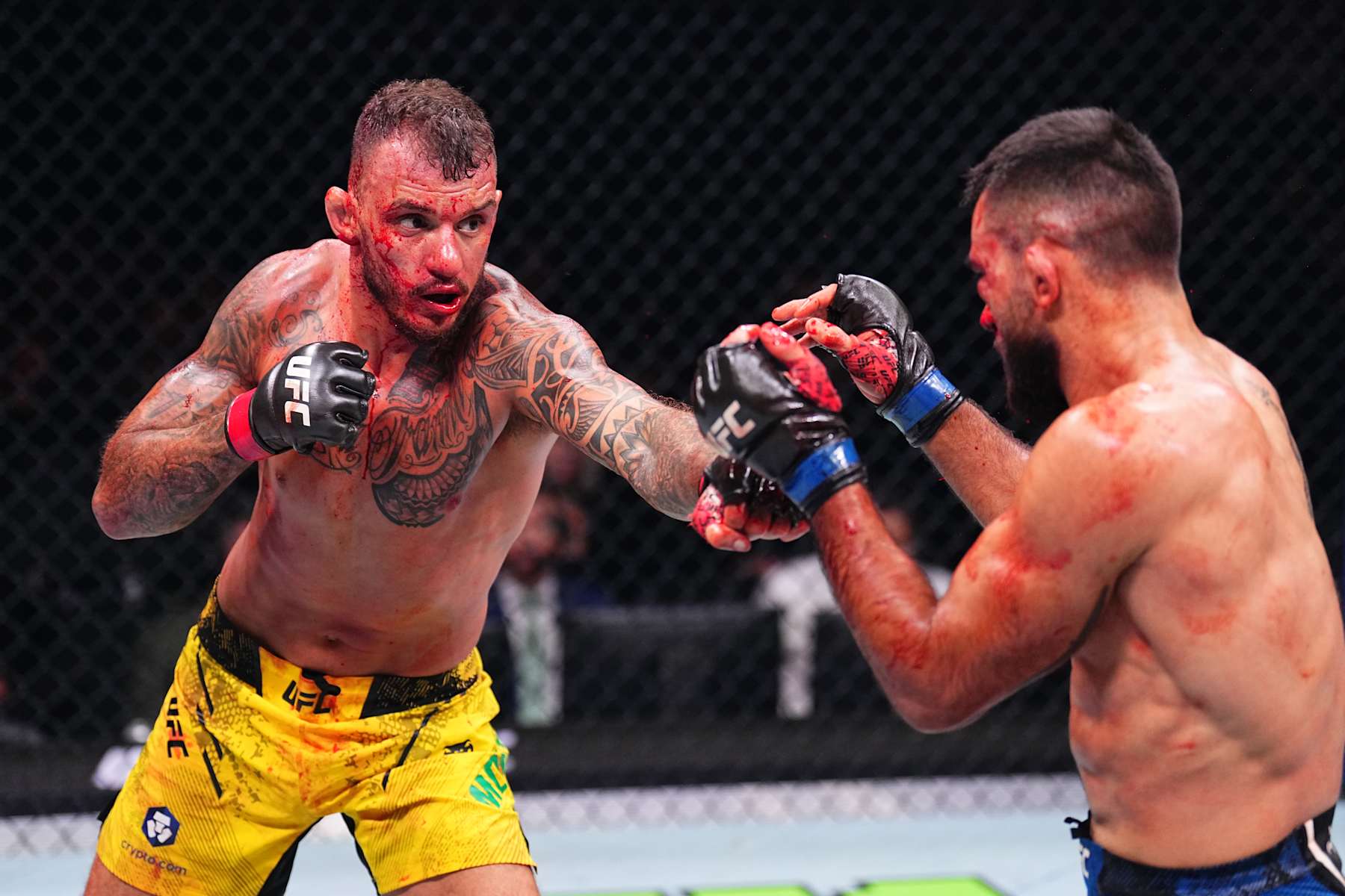PARIS, FRANCE - SEPTEMBER 28: (L-R) Renato Moicano of Brazil punches Benoit Saint Denis of France in a lightweight fight during the UFC Fight Night event at The Accor Arena on September 28, 2024 in Paris, France.  (Photo by Chris Unger/Zuffa LLC)