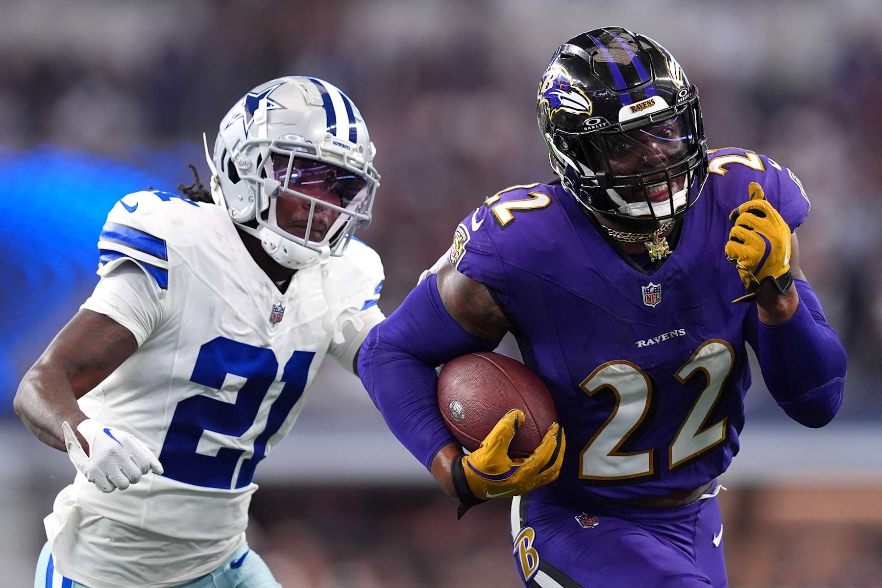 ARLINGTON, TEXAS - SEPTEMBER 22: Baltimore Ravens running back Derrick Henry #22 runs with the ball in front of Dallas Cowboys cornerback Caelen Carson #21 during the second half at AT&T Stadium on September 22, 2024 in Arlington, Texas. (Photo by Sam Hodde/Getty Images)