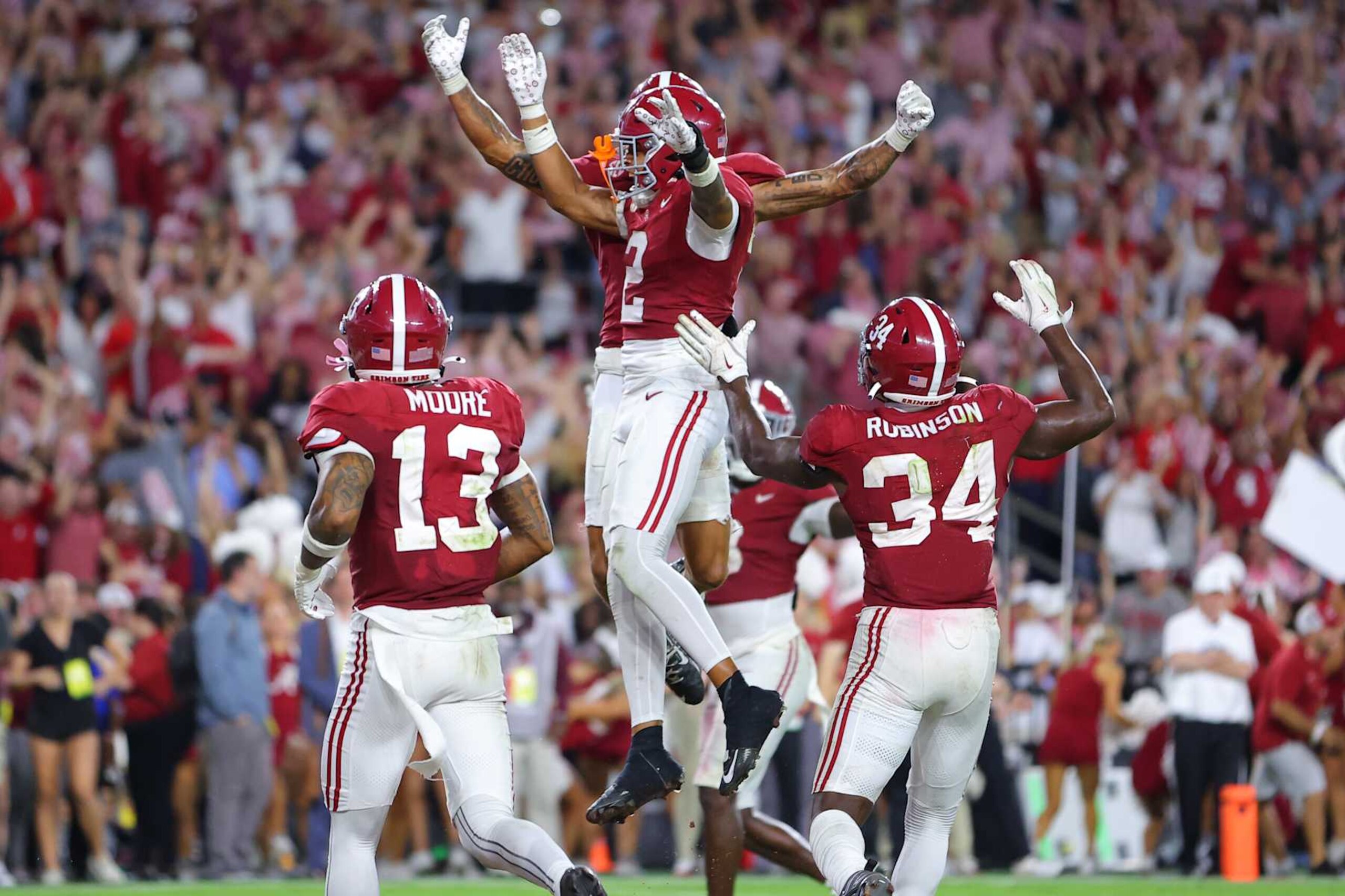 TUSCALOOSA, ALABAMA - SEPTEMBER 28: Zabien Brown #2 of the Alabama Crimson Tide celebrates after his interception against the Georgia Bulldogs with Domani Jackson #1 and teammates during the final minute of the fourth quarter at Bryant-Denny Stadium on September 28, 2024 in Tuscaloosa, Alabama. (Photo by Kevin C. Cox/Getty Images)