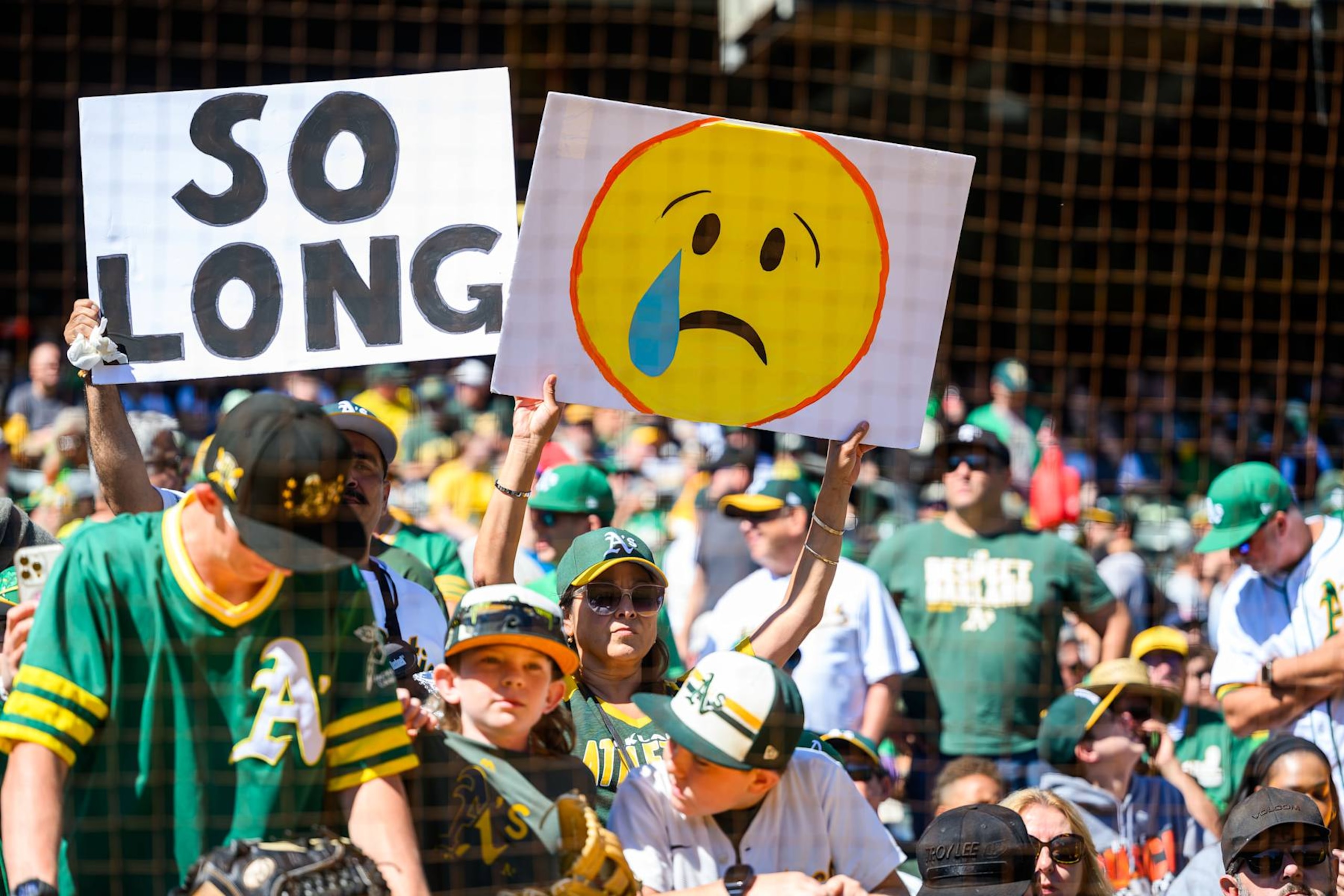 OAKLAND, CA - SEPTEMBER 26: Oakland Athletics fans hold up their signs before an MLB game between the Texas Rangers and Oakland Athletics on September 26, 2024, at the Oakland-Alameda County Coliseum in Oakland, CA. (Photo by Trinity Machan/Icon Sportswire via Getty Images) OAKLAND, CA - SEPTEMBER 26: Oakland Athletics fans hold up their signs before an MLB game between the Texas Rangers and Oakland Athletics on September 26, 2024, at the Oakland-Alameda County Coliseum in Oakland, CA. (Photo by Trinity Machan/Icon Sportswire via Getty Images)