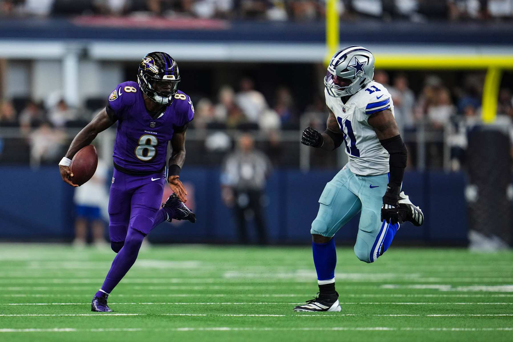ARLINGTON, TX - SEPTEMBER 22: Lamar Jackson #8 of the Baltimore Ravens runs the ball during an NFL football game against the Dallas Cowboys at AT&T Stadium on September 22, 2024 in Arlington, Texas. (Photo by Cooper Neill/Getty Images)