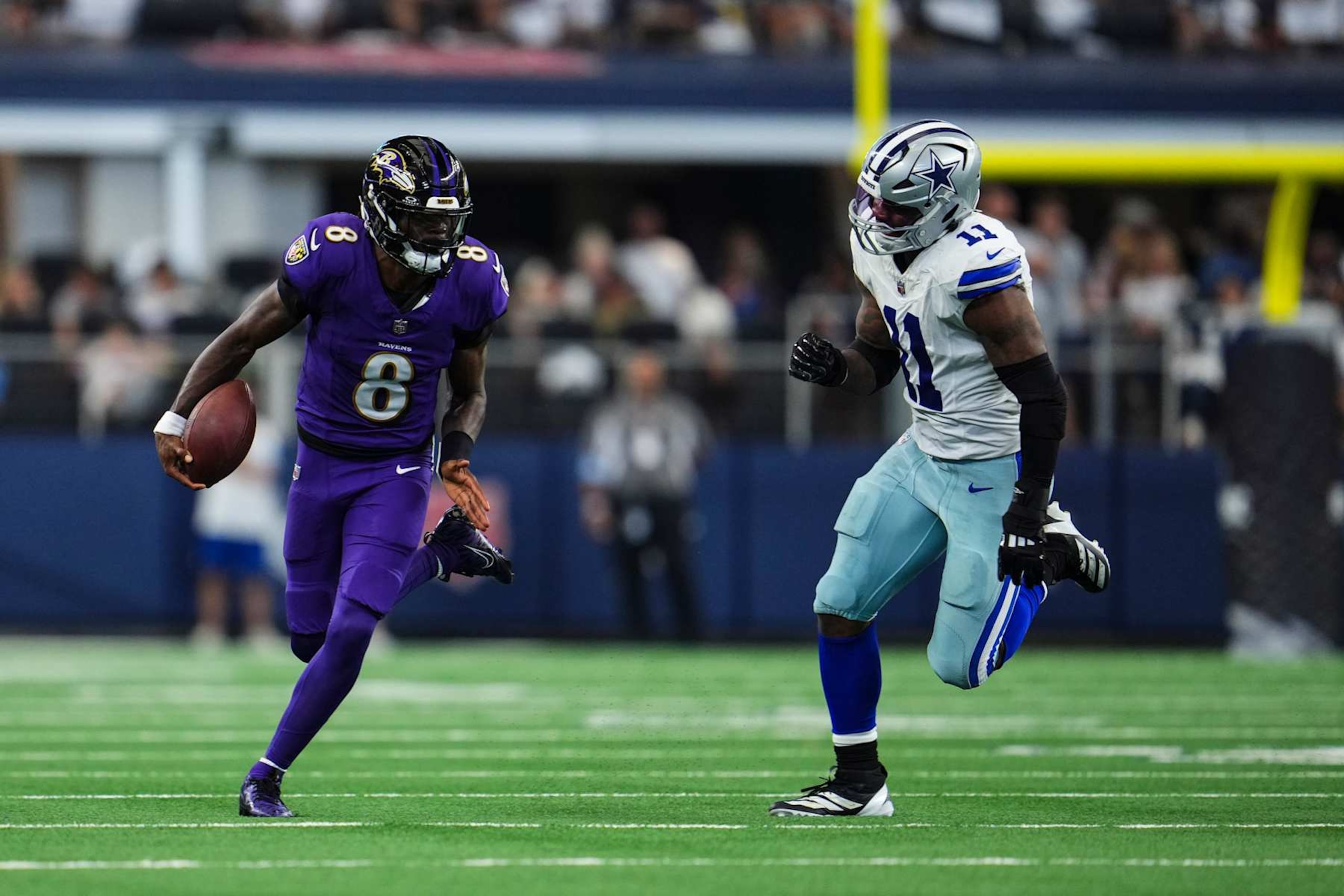 ARLINGTON, TX - SEPTEMBER 22: Lamar Jackson #8 of the Baltimore Ravens runs the ball during an NFL football game against the Dallas Cowboys at AT&T Stadium on September 22, 2024 in Arlington, Texas. (Photo by Cooper Neill/Getty Images) ARLINGTON, TX - SEPTEMBER 22: Lamar Jackson #8 of the Baltimore Ravens runs the ball during an NFL football game against the Dallas Cowboys at AT&T Stadium on September 22, 2024 in Arlington, Texas. (Photo by Cooper Neill/Getty Images)