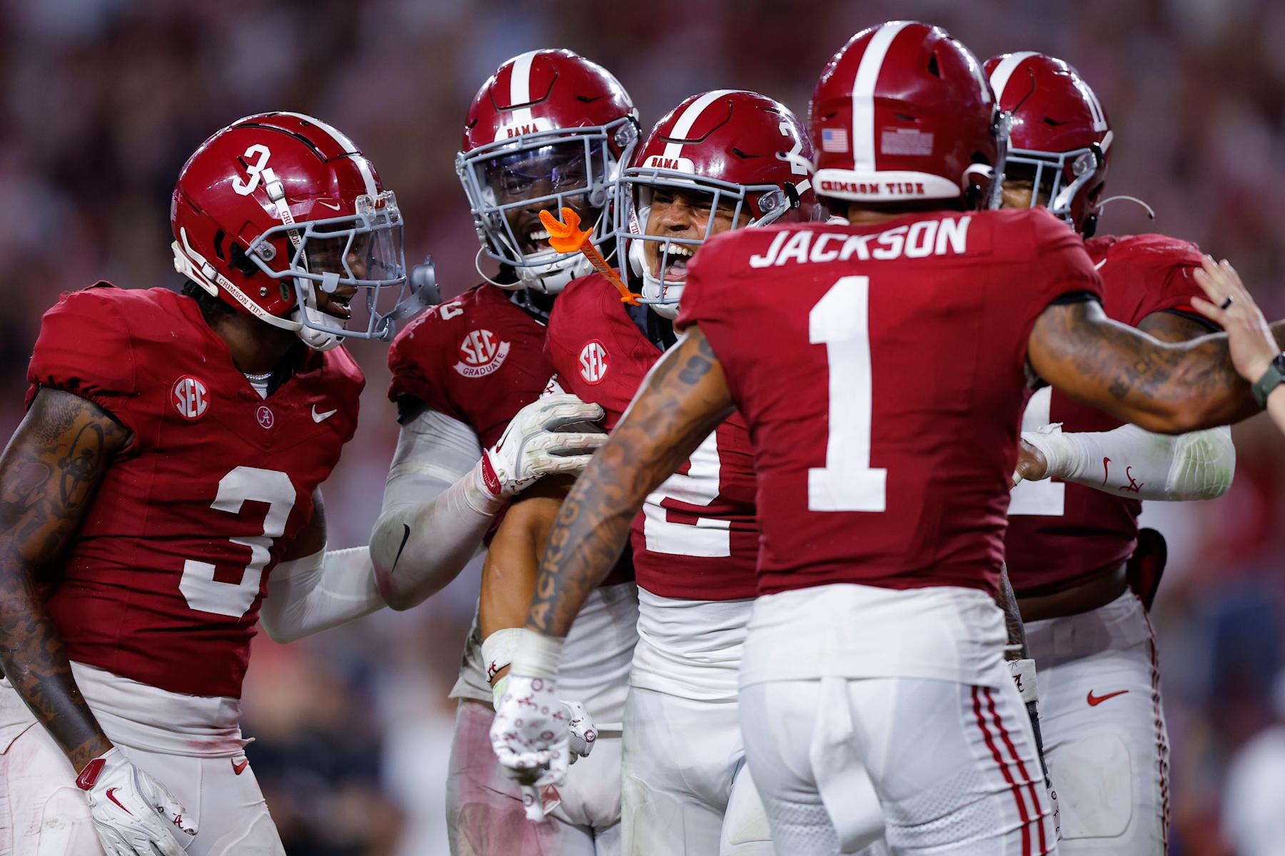 TUSCALOOSA, ALABAMA - SEPTEMBER 28: Zabien Brown #2 of the Alabama Crimson Tide celebrates after his interception against the Georgia Bulldogs with Domani Jackson #1 and teammates during the final minute of the fourth quarter at Bryant-Denny Stadium on September 28, 2024 in Tuscaloosa, Alabama. (Photo by Todd Kirkland/Getty Images)