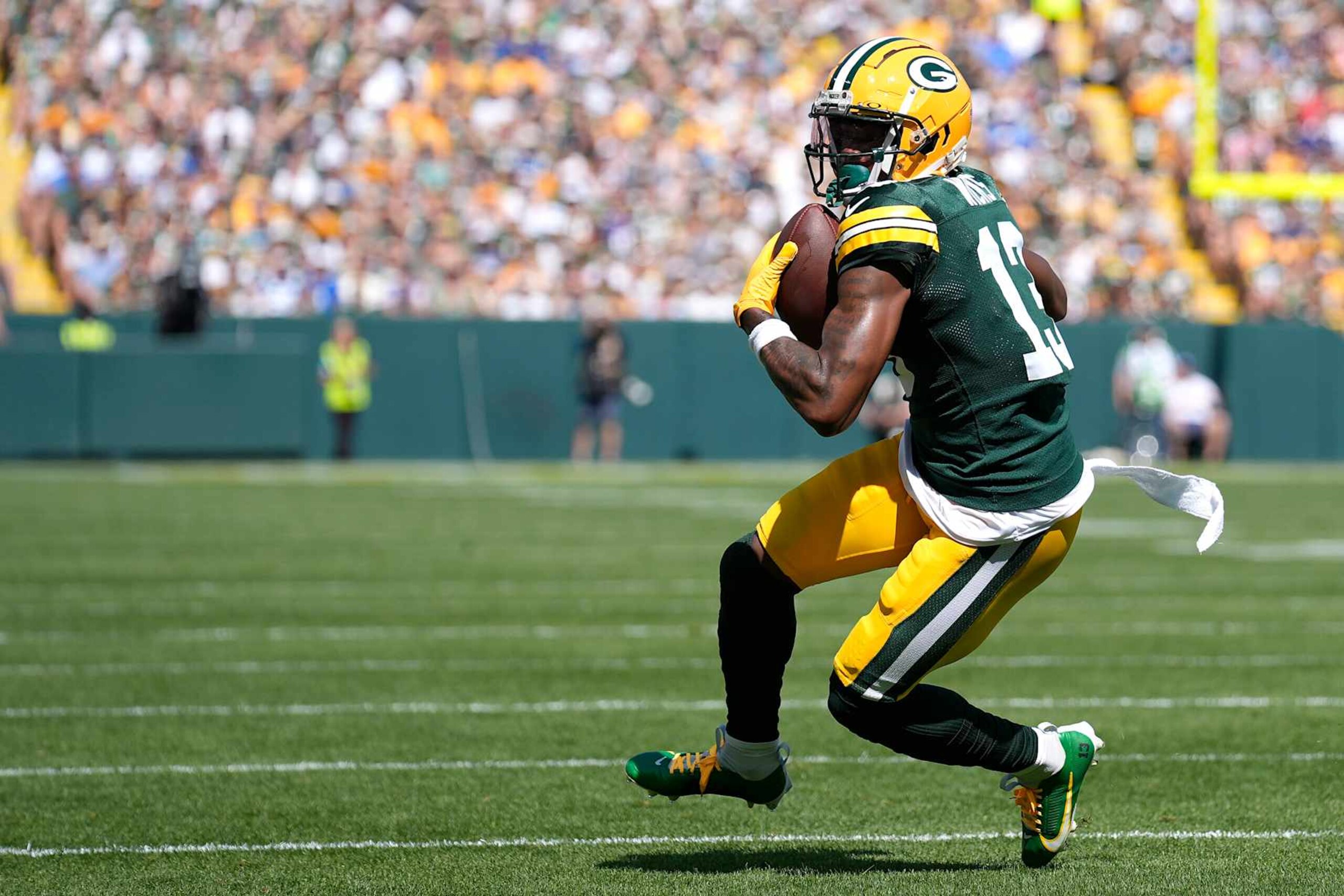 GREEN BAY, WISCONSIN - SEPTEMBER 15: Dontayvion Wicks #13 of the Green Bay Packers with the ball against the Indianapolis Colts during the first quarter at Lambeau Field on September 15, 2024 in Green Bay, Wisconsin. (Photo by Patrick McDermott/Getty Images) GREEN BAY, WISCONSIN - SEPTEMBER 15: Dontayvion Wicks #13 of the Green Bay Packers with the ball against the Indianapolis Colts during the first quarter at Lambeau Field on September 15, 2024 in Green Bay, Wisconsin. (Photo by Patrick McDermott/Getty Images)