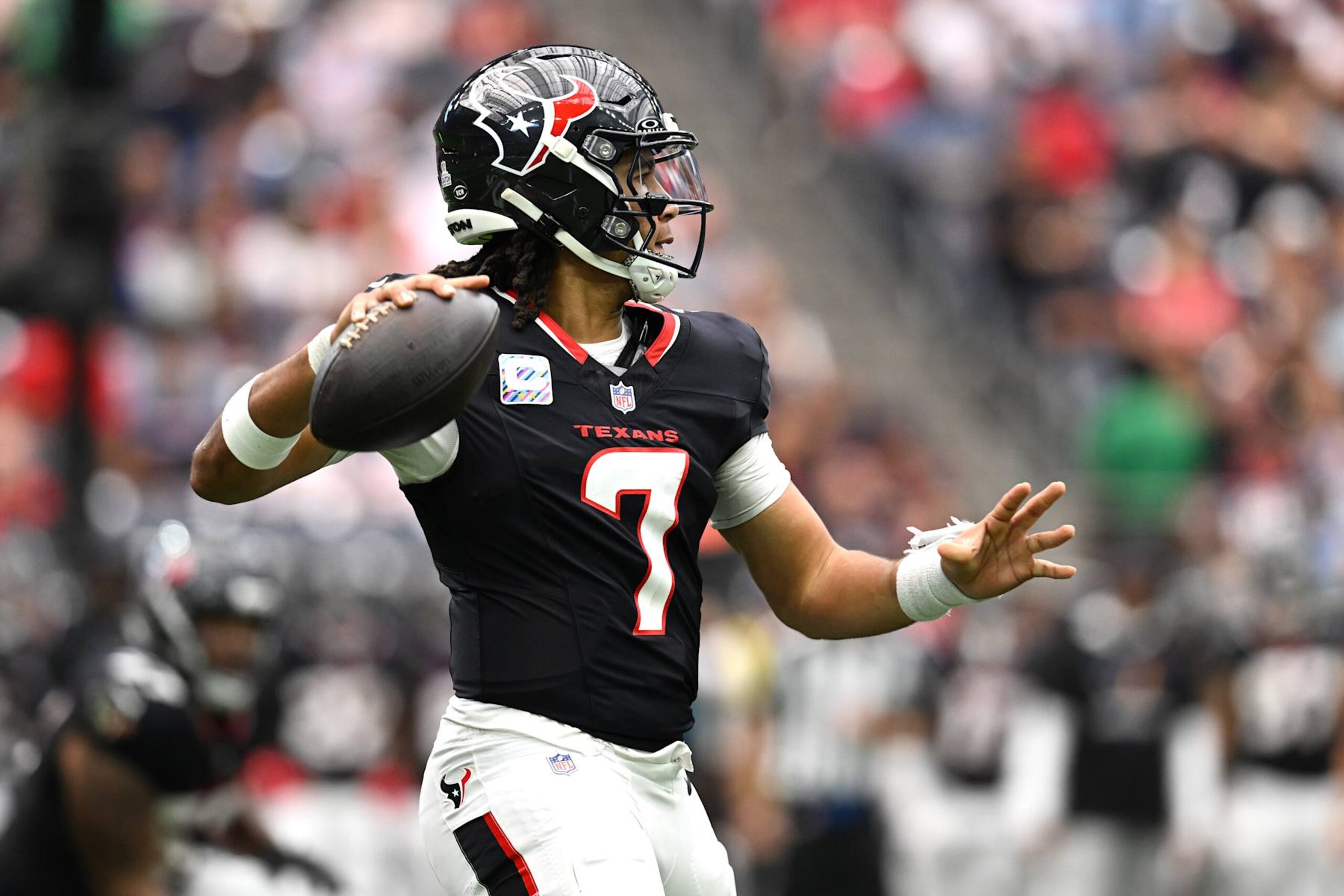 HOUSTON, TEXAS - SEPTEMBER 29: C.J. Stroud #7 of the Houston Texans throws a pass against the Jacksonville Jaguars during the first half of the game at NRG Stadium on September 29, 2024 in Houston, Texas. (Photo by Jack Gorman/Getty Images)