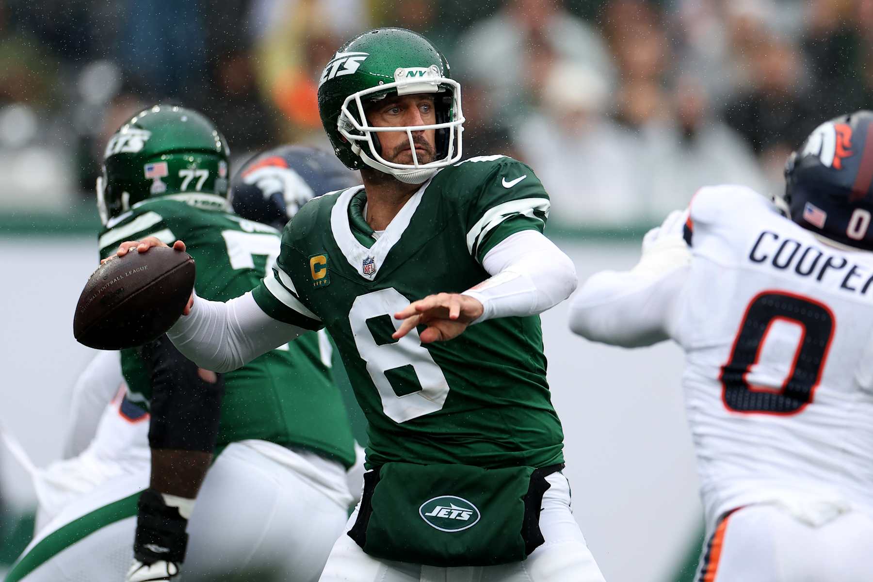 EAST RUTHERFORD, NEW JERSEY - SEPTEMBER 29: Aaron Rodgers (8) of the New York Jets looks to pass against the Denver Broncos during the first quarter at MetLife Stadium on September 29, 2024 in East Rutherford, New Jersey. (Photo by Luke Hales/Getty Images)