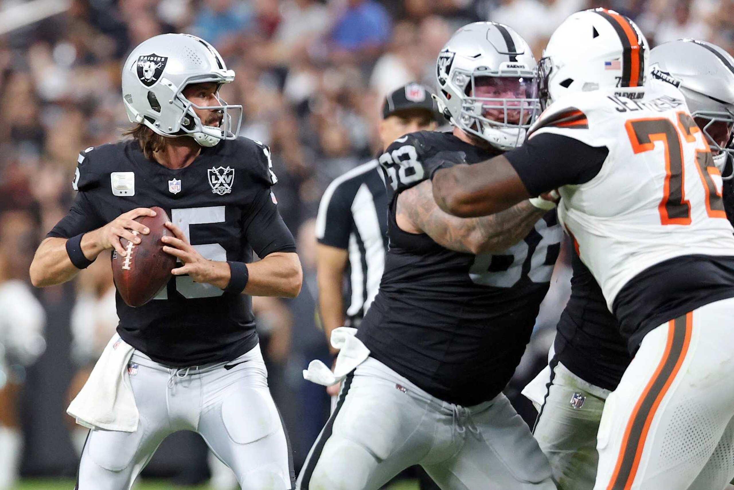 LAS VEGAS, NEVADA - SEPTEMBER 29: Gardner Minshew II #15 of the Las Vegas Raiders drops back to pass in the third quarter against the Cleveland Browns at Allegiant Stadium on September 29, 2024 in Las Vegas, Nevada. (Photo by Ian Maule/Getty Images)