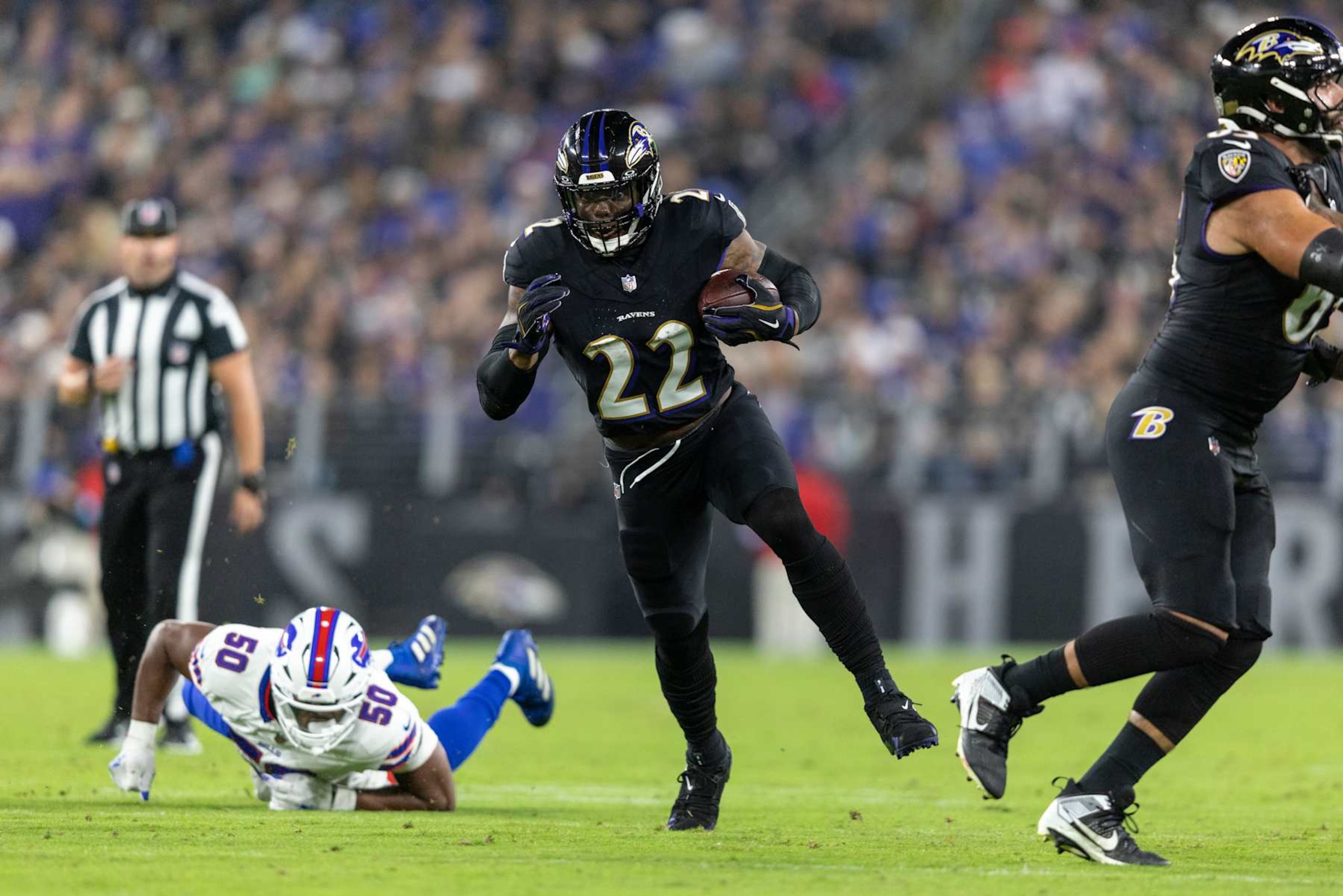 BALTIMORE, MARYLAND - SEPTEMBER 29: Derrick Henry #22 of the Baltimore Ravens runs with the ball during an NFL football game against the Buffalo Bills at M&T Bank Stadium on September 29, 2024 in Baltimore, Maryland. (Photo by Michael Owens/Getty Images) BALTIMORE, MARYLAND - SEPTEMBER 29: Derrick Henry #22 of the Baltimore Ravens runs with the ball during an NFL football game against the Buffalo Bills at M&T Bank Stadium on September 29, 2024 in Baltimore, Maryland. (Photo by Michael Owens/Getty Images)