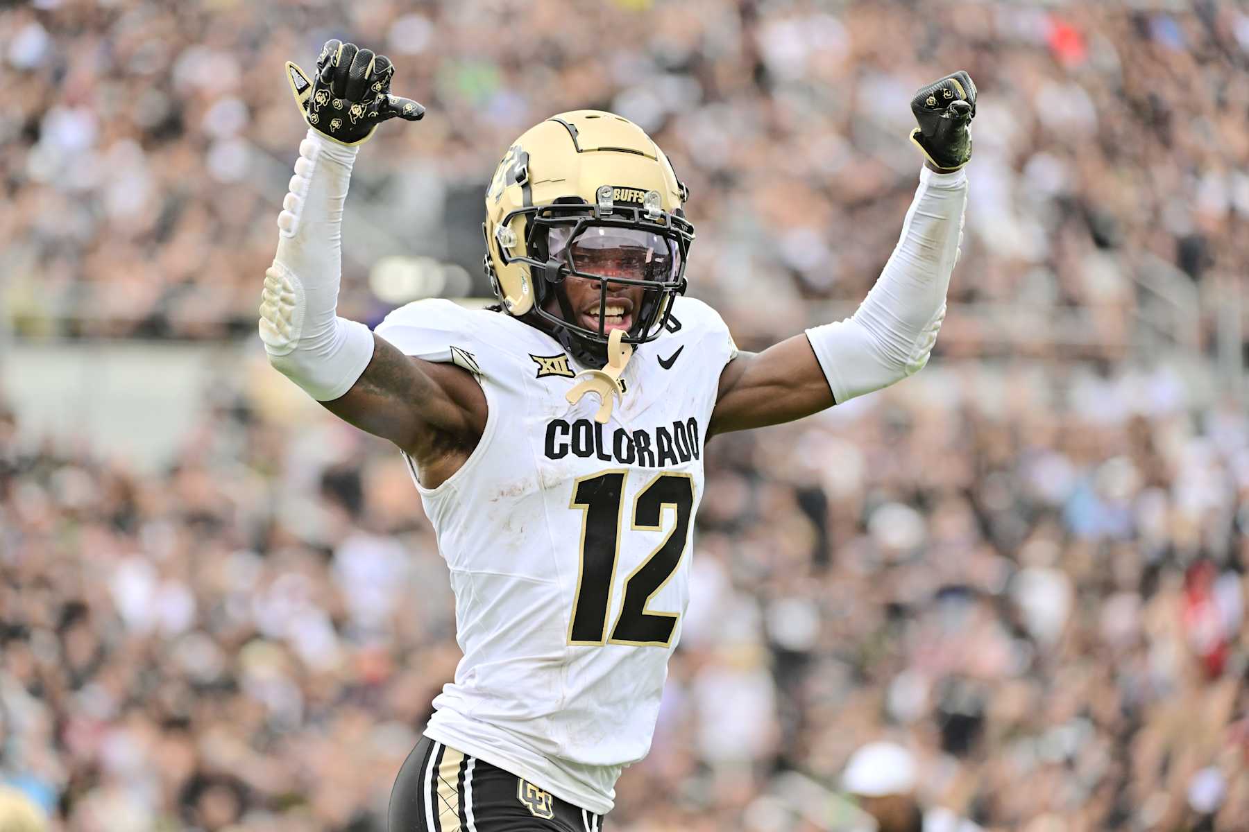 ORLANDO, FLORIDA - SEPTEMBER 28: Travis Hunter #12 of the Colorado Buffaloes reacts after scoring a touchdown in the first half of a game against the UCF Knights at FBC Mortgage Stadium on September 28, 2024 in Orlando, Florida. (Photo by Julio Aguilar/Getty Images)