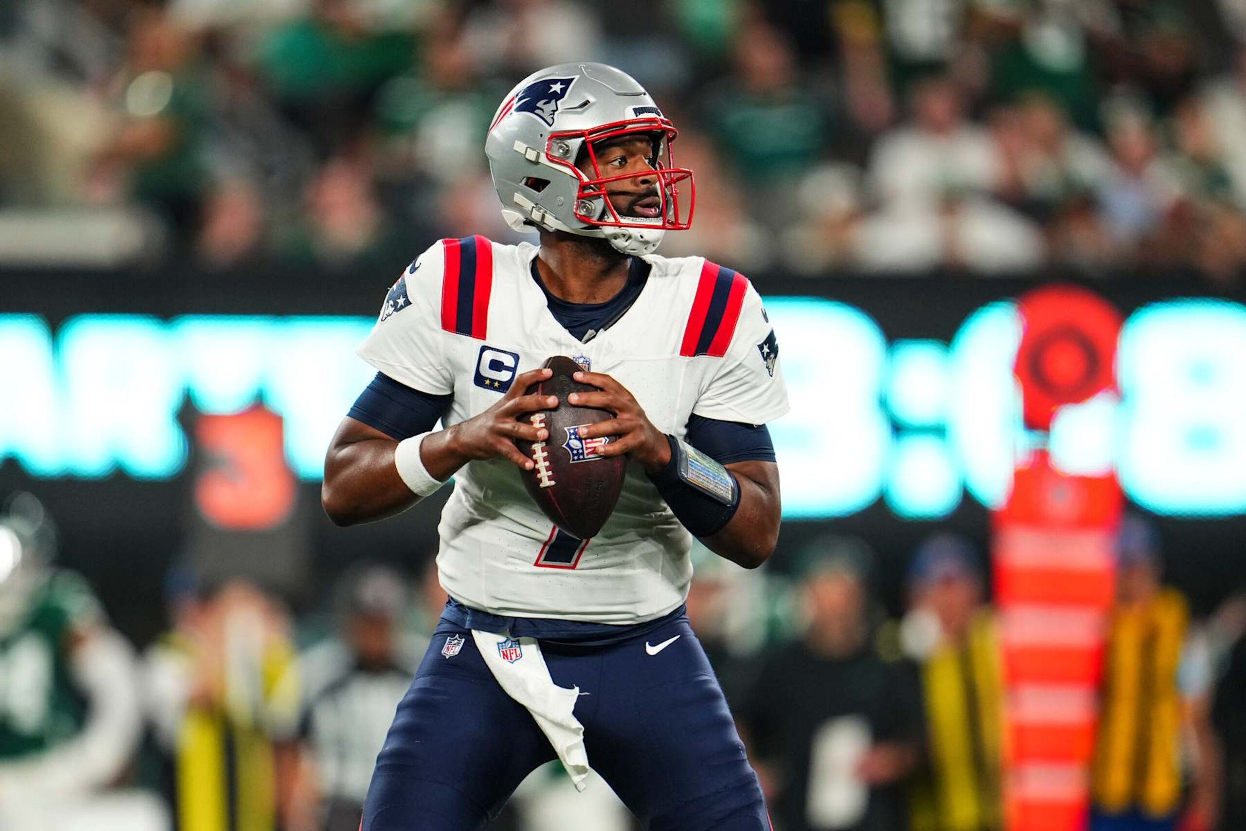 EAST RUTHERFORD, NJ - SEPTEMBER 19: Jacoby Brissett #7 of the New England Patriots drops back to pass during an NFL football game against the New York Jets at MetLife Stadium on September 19, 2024 in East Rutherford, New Jersey. (Photo by Cooper Neill/Getty Images)