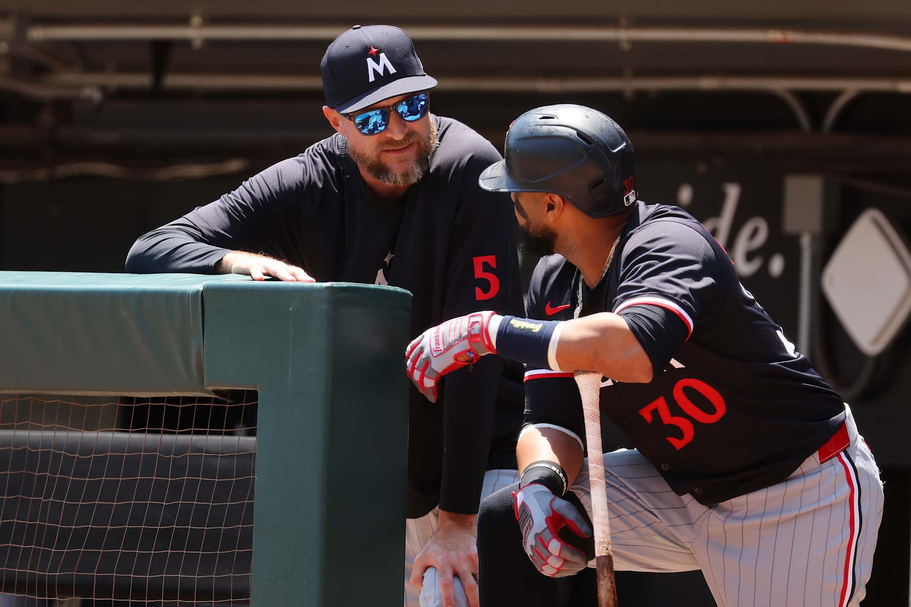 Rocco Baldelli (L) and Carlos Santana (R)