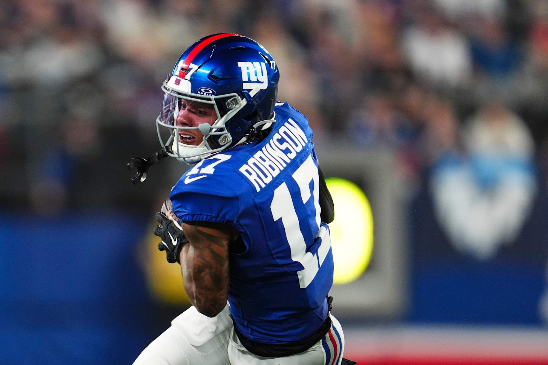 EAST RUTHERFORD, NJ - SEPTEMBER 26: Wan'Dale Robinson #17 of the New York Giants runs the ball during an NFL football game against the Dallas Cowboys at MetLife Stadium on September 26, 2024 in East Rutherford, New Jersey. (Photo by Cooper Neill/Getty Images)