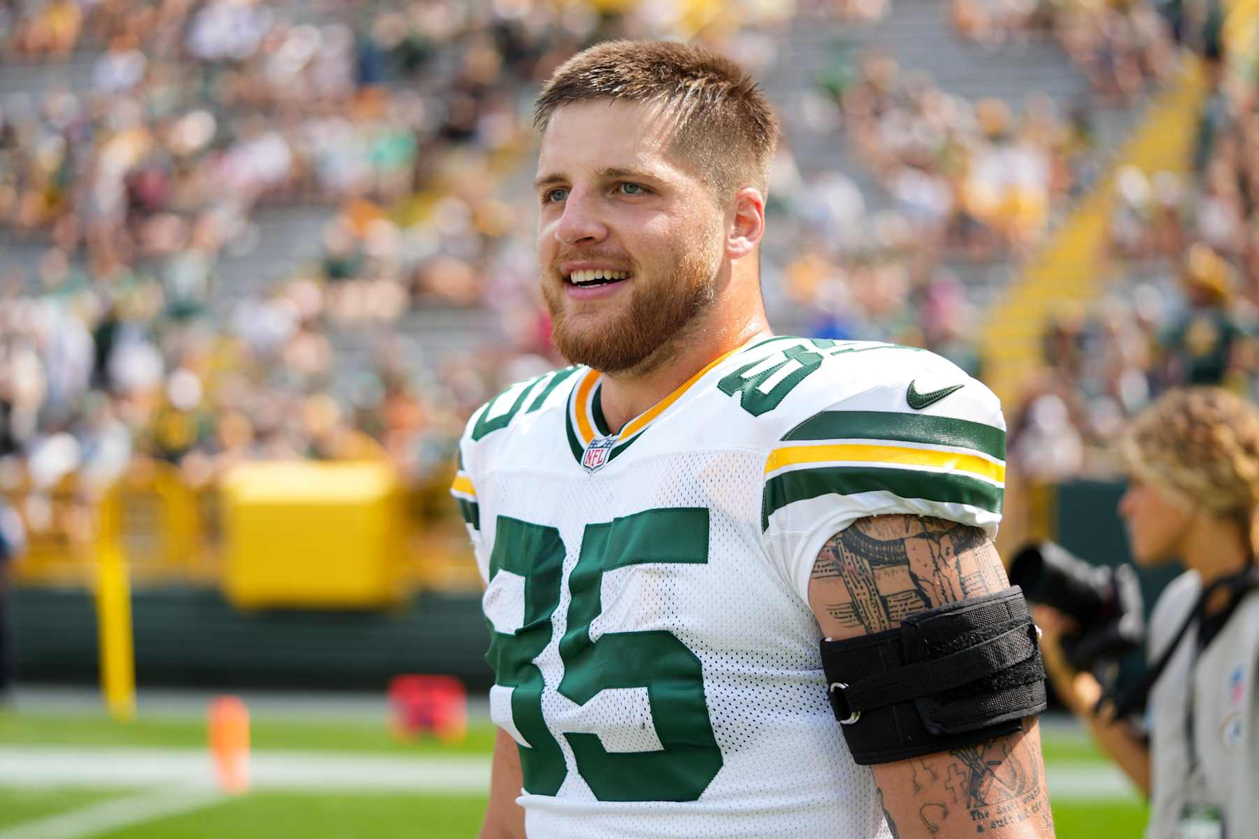 GREEN BAY, WISCONSIN - AUGUST 24: Tight end Tucker Kraft #85 of the Green Bay Packers stands on the field prior to an NFL preseason football game against the Baltimore Ravens, at Lambeau Field on August 24, 2024 in Green Bay, Wisconsin. (Photo by Todd Rosenberg/Getty Images)