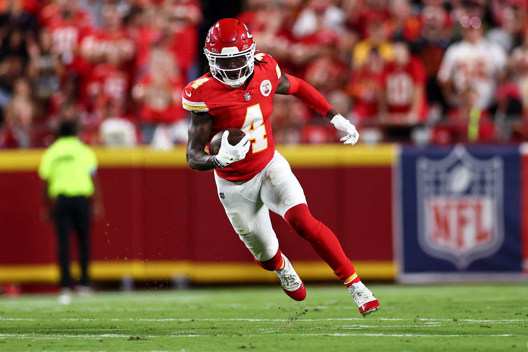 KANSAS CITY, MO - SEPTEMBER 5: Rashee Rice #4 of the Kansas City Chiefs carries the ball during an NFL football game against the Baltimore Ravens at GEHA Field at Arrowhead Stadium on September 5, 2024 in Kansas City, Missouri. (Photo by Kevin Sabitus/Getty Images)