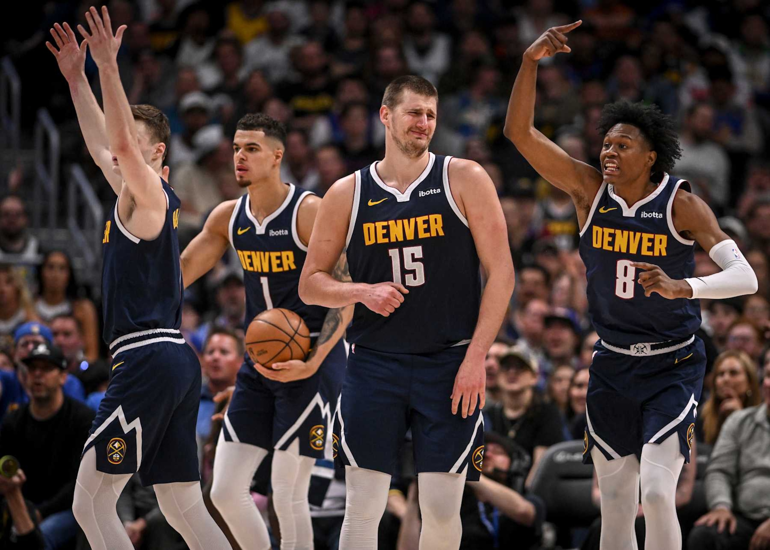 DENVER, CO - APRIL 10: Christian Braun (0), Michael Porter Jr. (1), Nikola Jokic (15) and Peyton Watson (8) of the Denver Nuggets contest a call in unison during the fourth quarter of the Nuggets' 116-107 win over the Minnesota Timberwolves at Ball Arena in Denver on Wednesday, April 10, 2024. (Photo by AAron Ontiveroz/The Denver Post)