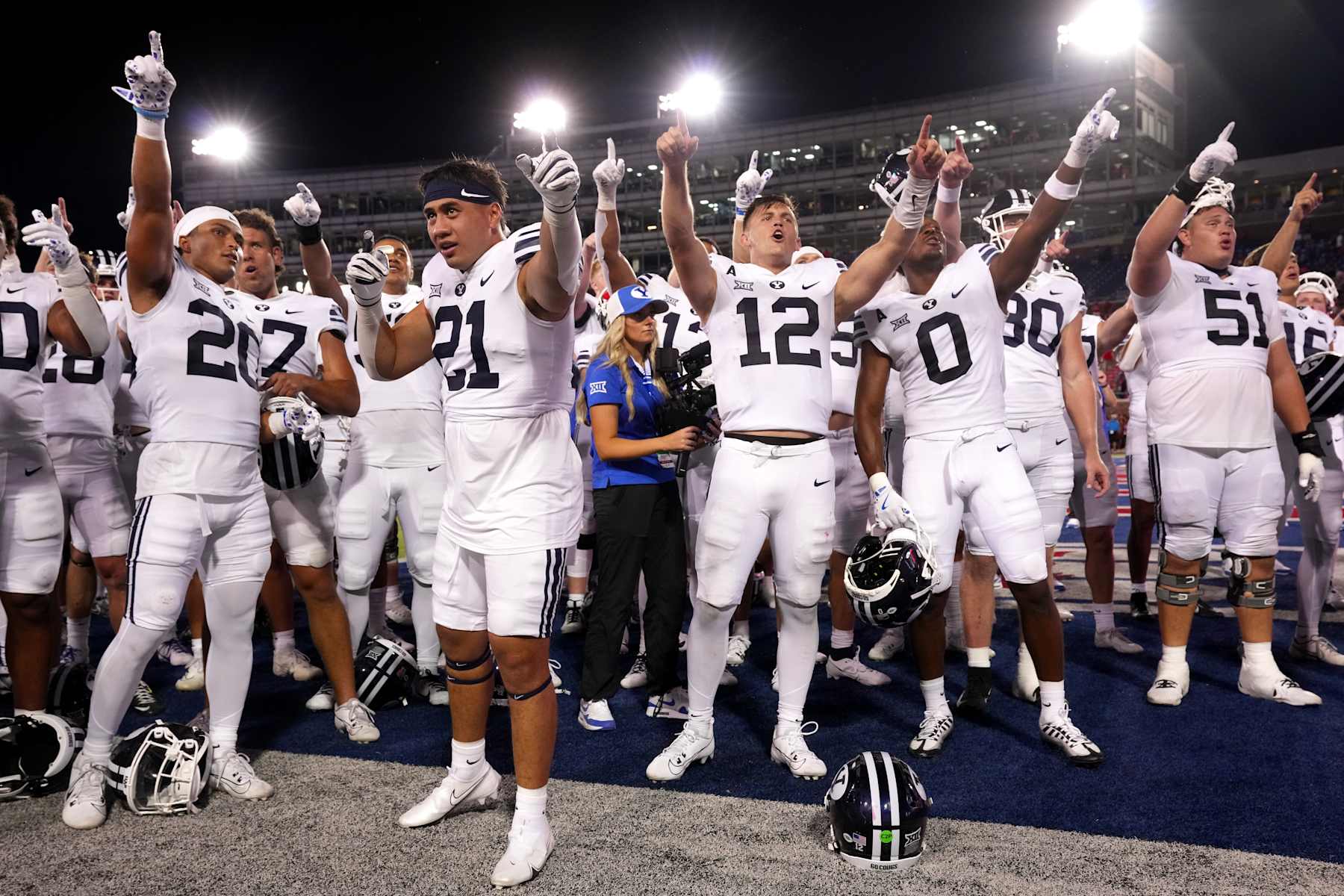 DALLAS, TEXAS - SEPTEMBER 06: Enoch Nawahine #21 and Jake Retzlaff #12 of the Brigham Young Cougars celebrate with teammates after defeating the Southern Methodist Mustangs at Gerald J. Ford Stadium on September 06, 2024 in Dallas, Texas. (Photo by Sam Hodde/Getty Images)