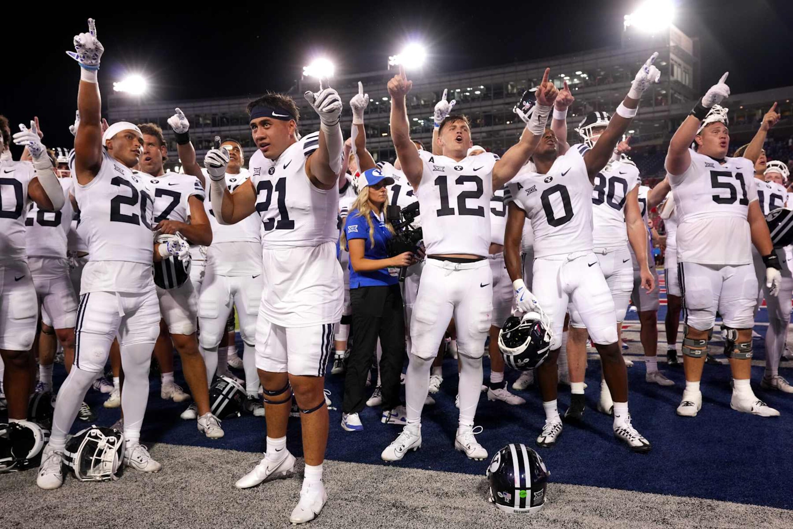 DALLAS, TEXAS - SEPTEMBER 06: Enoch Nawahine #21 and Jake Retzlaff #12 of the Brigham Young Cougars celebrate with teammates after defeating the Southern Methodist Mustangs at Gerald J. Ford Stadium on September 06, 2024 in Dallas, Texas. (Photo by Sam Hodde/Getty Images) DALLAS, TEXAS - SEPTEMBER 06: Enoch Nawahine #21 and Jake Retzlaff #12 of the Brigham Young Cougars celebrate with teammates after defeating the Southern Methodist Mustangs at Gerald J. Ford Stadium on September 06, 2024 in Dallas, Texas. (Photo by Sam Hodde/Getty Images)