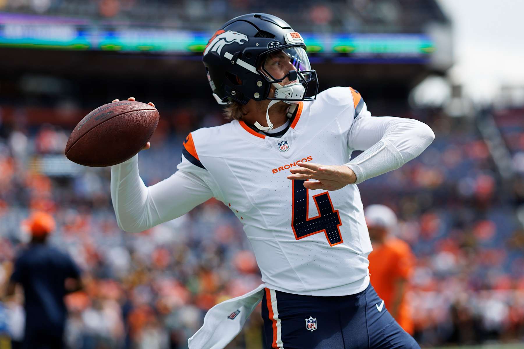 DENVER, CO - SEPTEMBER 15: Quarterback Zach Wilson #4 of the Denver Broncos warms up prior to an NFL football game against the Pittsburgh Steelers, at Empower Field at Mile High on September 15, 2024 in Denver, Colorado. (Photo by Brooke Sutton/Getty Images)