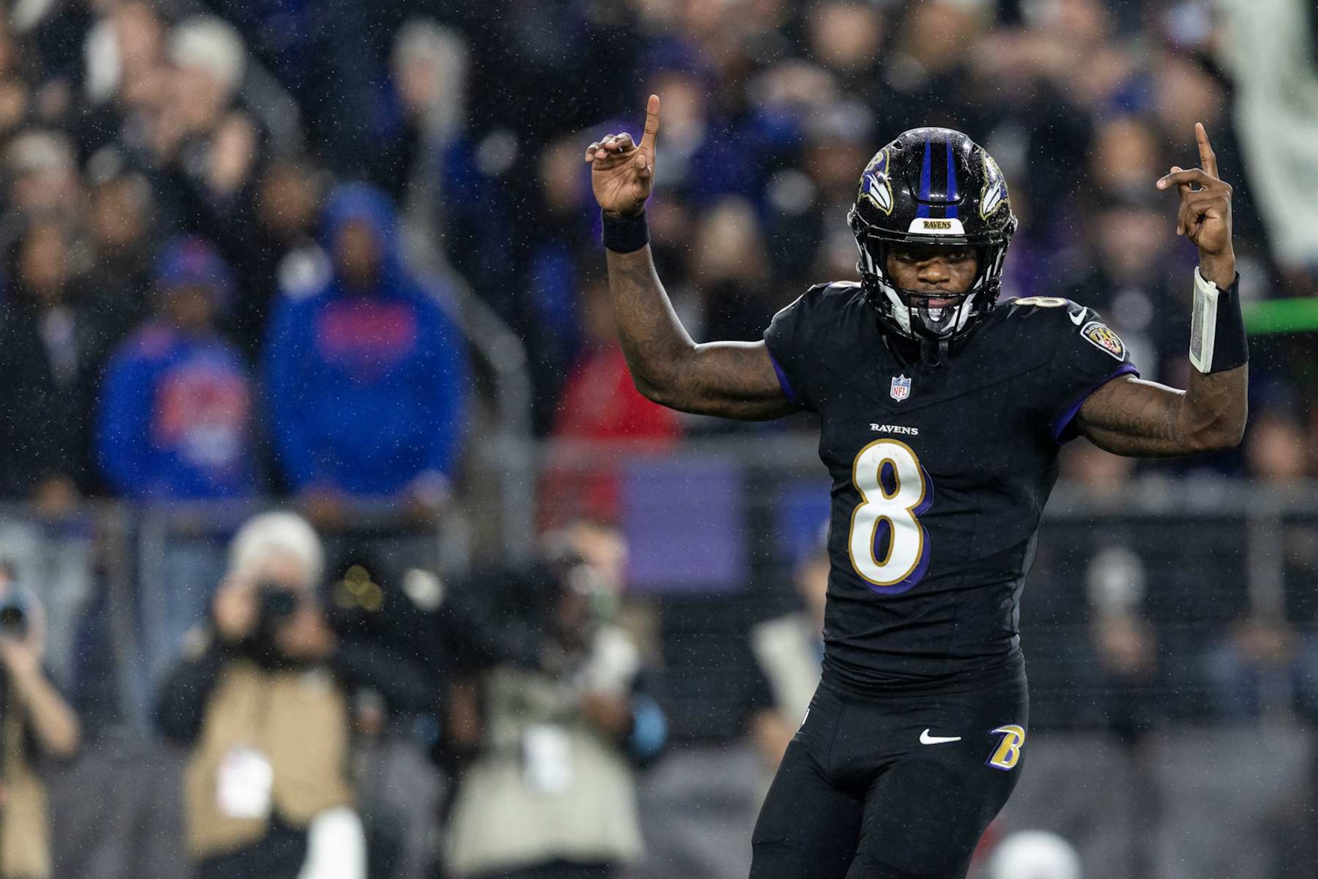 BALTIMORE, MARYLAND - SEPTEMBER 29: Lamar Jackson #8 of the Baltimore Ravens celebrates after a touchdown during an NFL football game against the Buffalo Bills at M&T Bank Stadium on September 29, 2024 in Baltimore, Maryland. (Photo by Michael Owens/Getty Images)