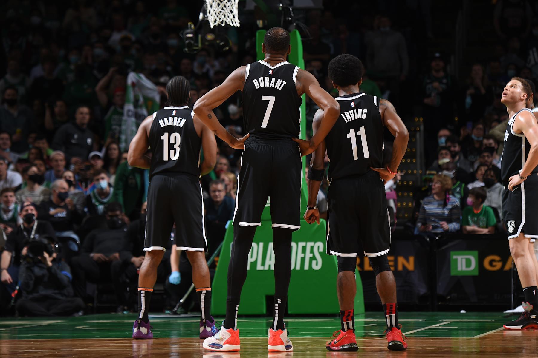BOSTON, MA - MAY 30: James Harden #13, Kevin Durant #7, and Kyrie Irving #11 of the Brooklyn Nets look on during Round 1, Game 4 of the 2021 NBA Playoffs on May 30, 2021 at the TD Garden in Boston, Massachusetts.  NOTE TO USER: User expressly acknowledges and agrees that, by downloading and or using this photograph, User is consenting to the terms and conditions of the Getty Images License Agreement. Mandatory Copyright Notice: Copyright 2021 NBAE  (Photo by Brian Babineau/NBAE via Getty Images)