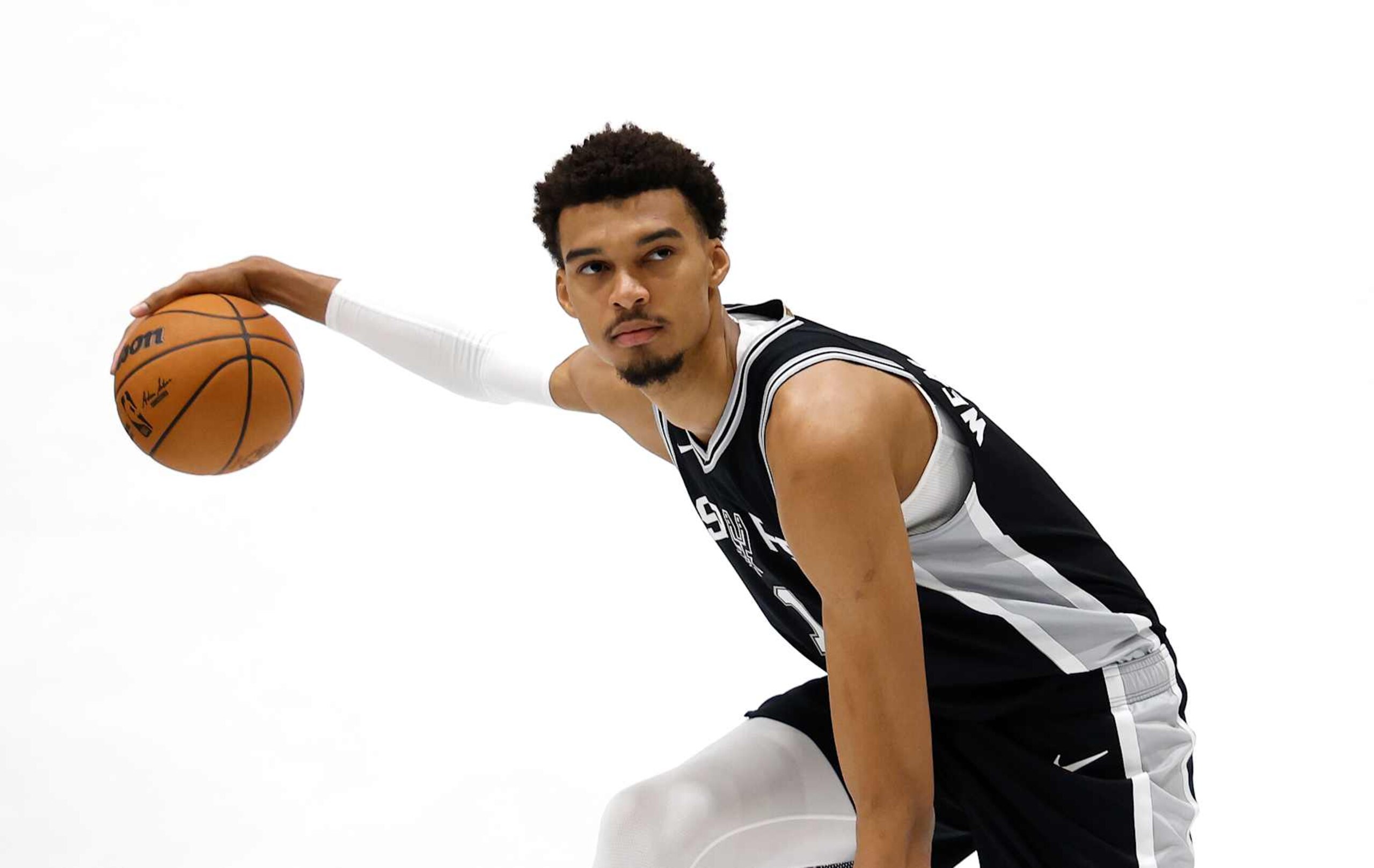 SAN ANTONIO, TX - SEPTEMBER 30: Victor Wembanyama #1 of the San Antonio Spurs poses at San Antonio Spurs Media Day at the Victory Capital Performance Center on September 30, 2024 in San Antonio, Texas. NOTE TO USER: User expressly acknowledges and agrees that, by downloading and or using this photograph, User is consenting to terms and conditions of the Getty Images License Agreement. (Photo by Ronald Cortes/Getty Images)