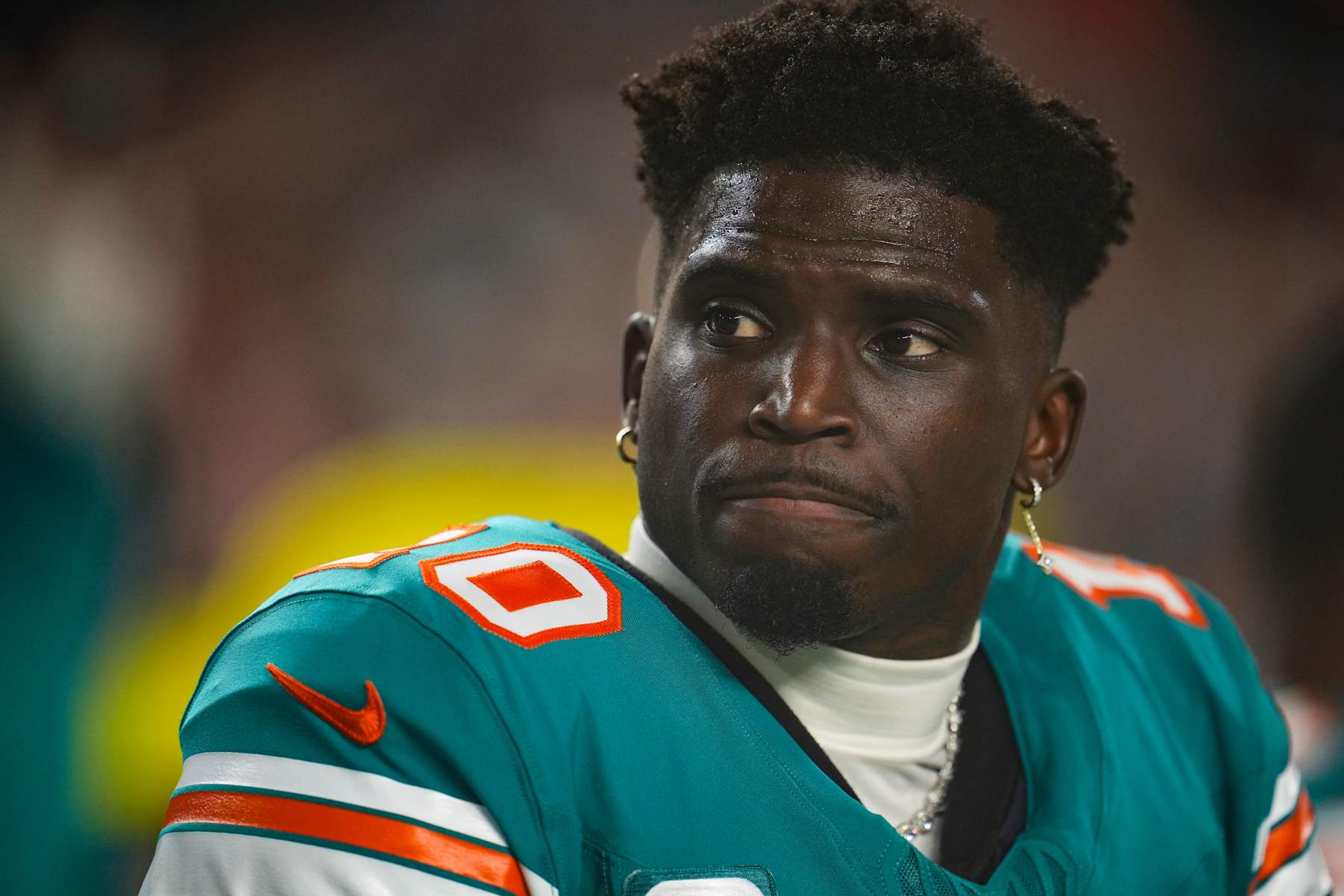 MIAMI GARDENS, FL - SEPTEMBER 12: Tyreek Hill #10 of the Miami Dolphins looks on from the sideline prior to an NFL football game against the Buffalo Bills at Hard Rock Stadium on September 12, 2024 in Miami Gardens, Florida. (Photo by Cooper Neill/Getty Images)