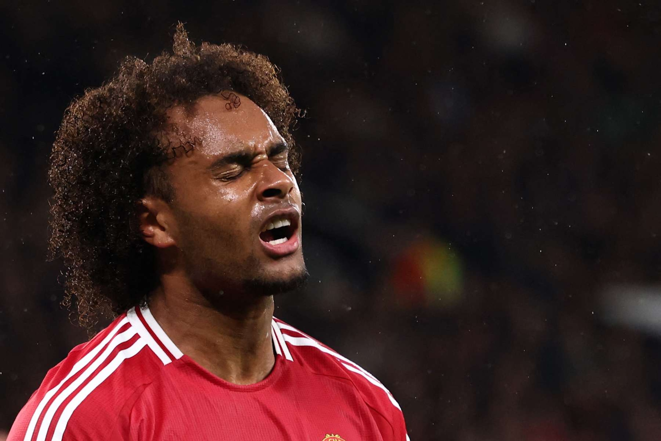 Manchester United's Dutch striker #11 Joshua Zirkzee reacts after missing a chance on goal during the UEFA Europa league stage football match between Manchester United and FC Twente at Old Trafford stadium in Manchester, north west England, on September 25, 2024. (Photo by Darren Staples / AFP) (Photo by DARREN STAPLES/AFP via Getty Images)