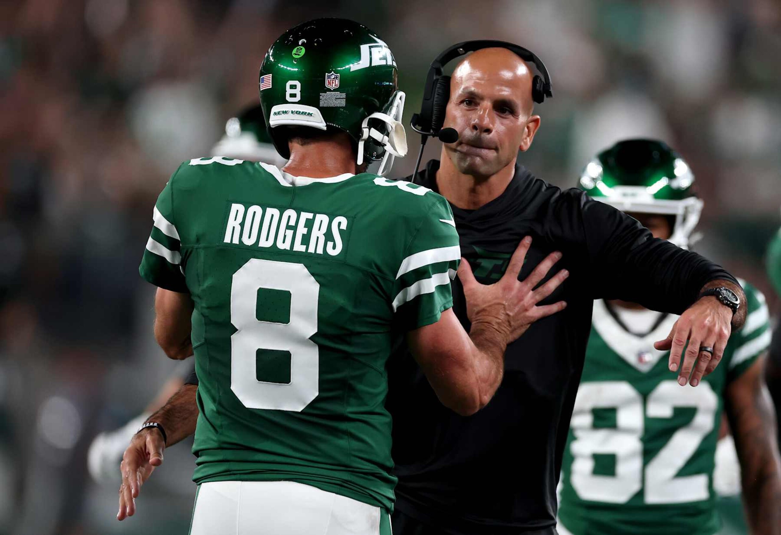 EAST RUTHERFORD, NEW JERSEY - SEPTEMBER 19: Head coach Robert Saleh of the New York Jets celebrates with Aaron Rodgers #8 after a touchdown against the New England Patriots during the second quarter in the game at MetLife Stadium on September 19, 2024 in East Rutherford, New Jersey. (Photo by Al Bello/Getty Images) EAST RUTHERFORD, NEW JERSEY - SEPTEMBER 19: Head coach Robert Saleh of the New York Jets celebrates with Aaron Rodgers #8 after a touchdown against the New England Patriots during the second quarter in the game at MetLife Stadium on September 19, 2024 in East Rutherford, New Jersey. (Photo by Al Bello/Getty Images)