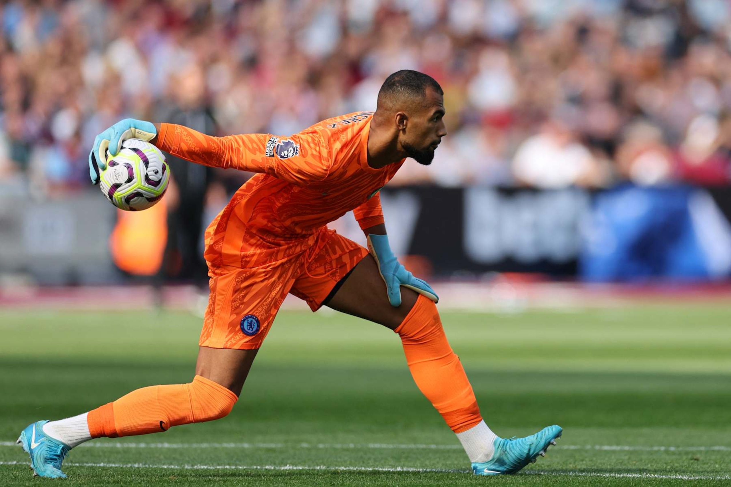 Chelsea's Spanish goalkeeper #01 Robert Sanchez rolls the ball out during the English Premier League football match between West Ham United and Chelsea at the London Stadium, in London on September 21, 2024. (Photo by Adrian Dennis / AFP) / RESTRICTED TO EDITORIAL USE. No use with unauthorized audio, video, data, fixture lists, club/league logos or 'live' services. Online in-match use limited to 120 images. An additional 40 images may be used in extra time. No video emulation. Social media in-match use limited to 120 images. An additional 40 images may be used in extra time. No use in betting publications, games or single club/league/player publications. /  (Photo by ADRIAN DENNIS/AFP via Getty Images)