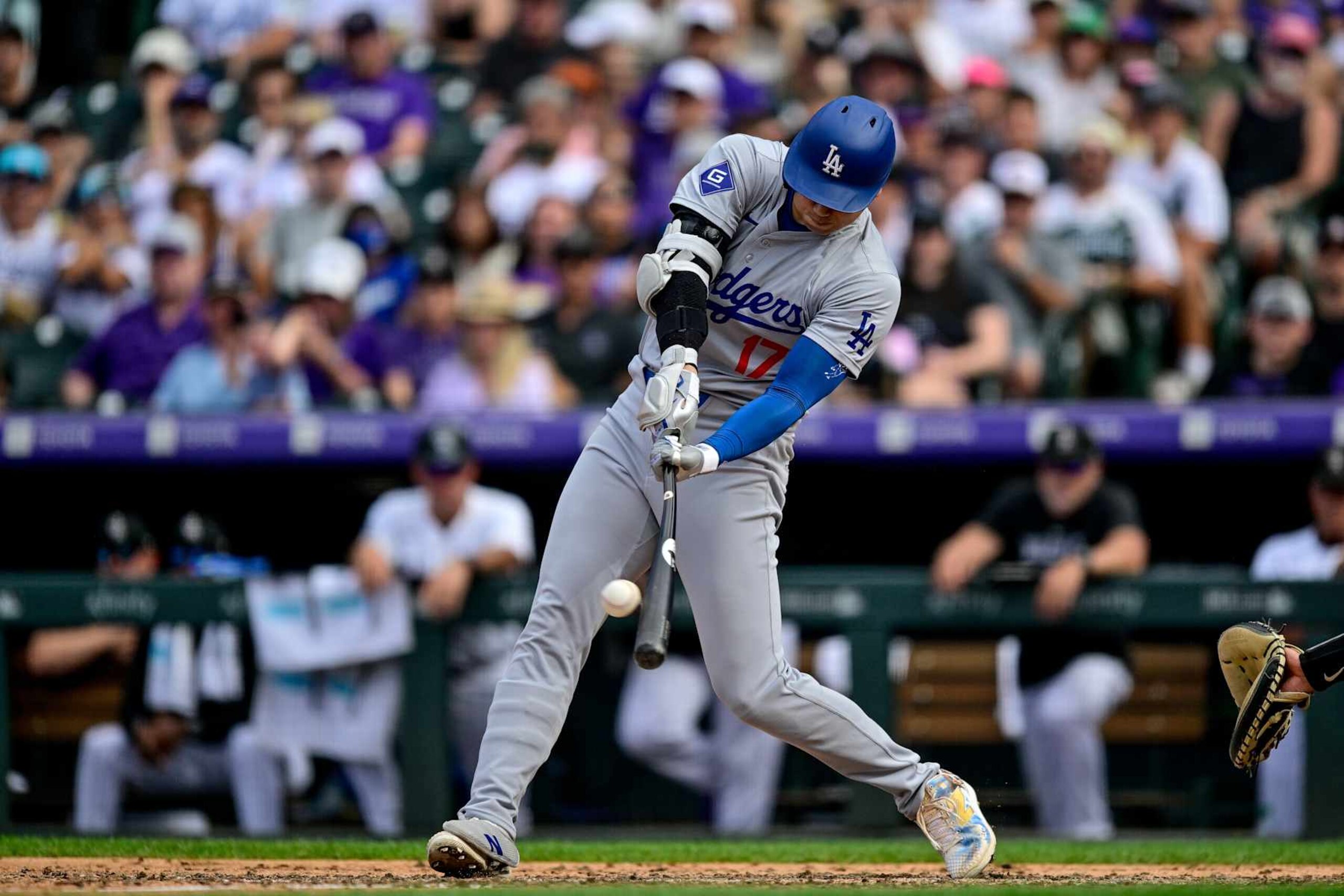 DENVER, CO - SEPTEMBER 29: Los Angeles Dodgers designated hitter Shohei Ohtani (17) singles in the eighth inning during a game between the Los Angeles Dodgers and the Colorado Rockies at Coors Field on September 29, 2024 in Denver, Colorado. (Photo by Dustin Bradford/Icon Sportswire via Getty Images) DENVER, CO - SEPTEMBER 29: Los Angeles Dodgers designated hitter Shohei Ohtani (17) singles in the eighth inning during a game between the Los Angeles Dodgers and the Colorado Rockies at Coors Field on September 29, 2024 in Denver, Colorado. (Photo by Dustin Bradford/Icon Sportswire via Getty Images)