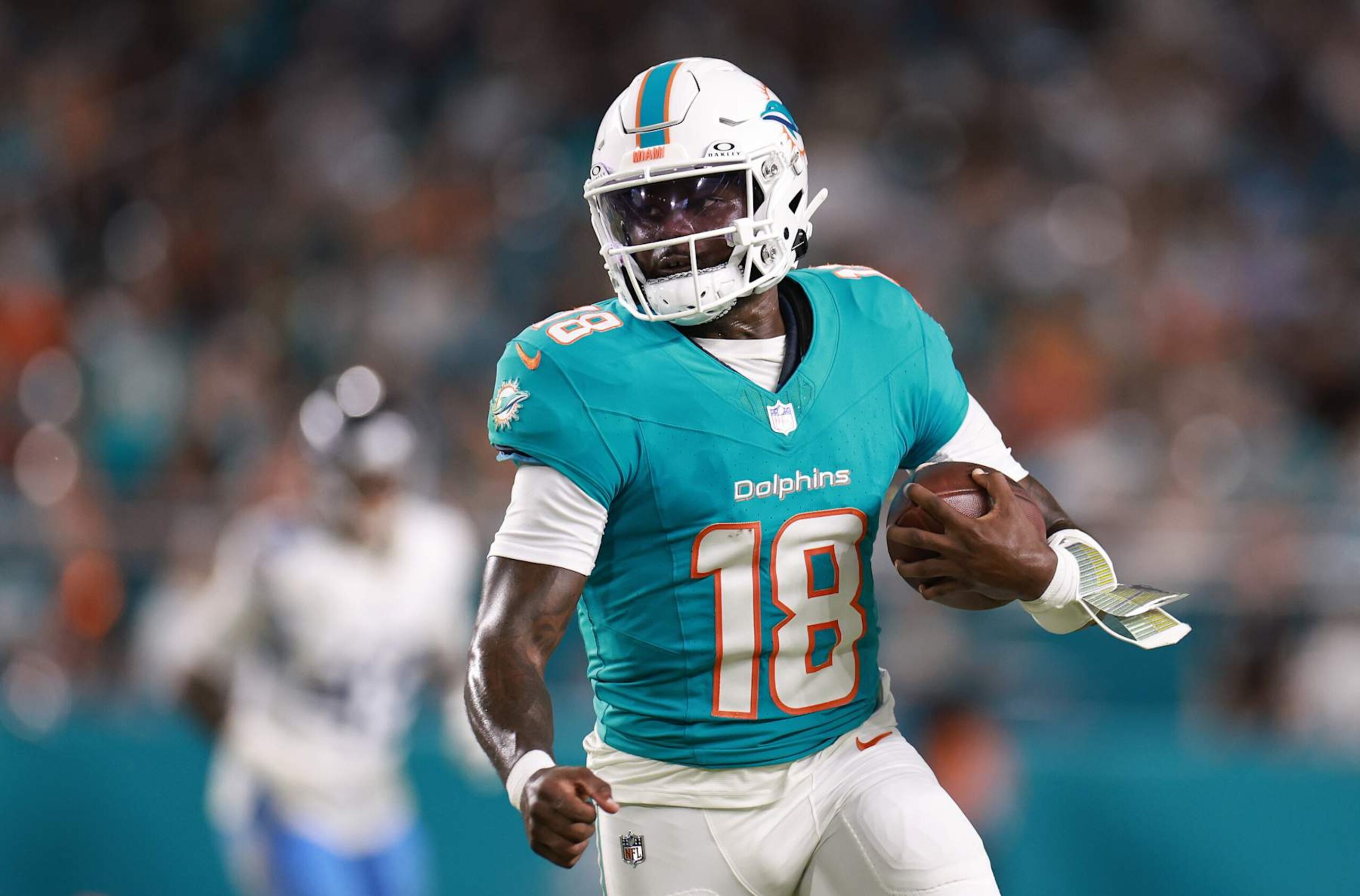 MIAMI GARDENS, FLORIDA - SEPTEMBER 30: Tyler Huntley #18 of the Miami Dolphins runs with the ball during the second quarter at Hard Rock Stadium on September 30, 2024 in Miami Gardens, Florida. (Photo by Carmen Mandato/Getty Images)