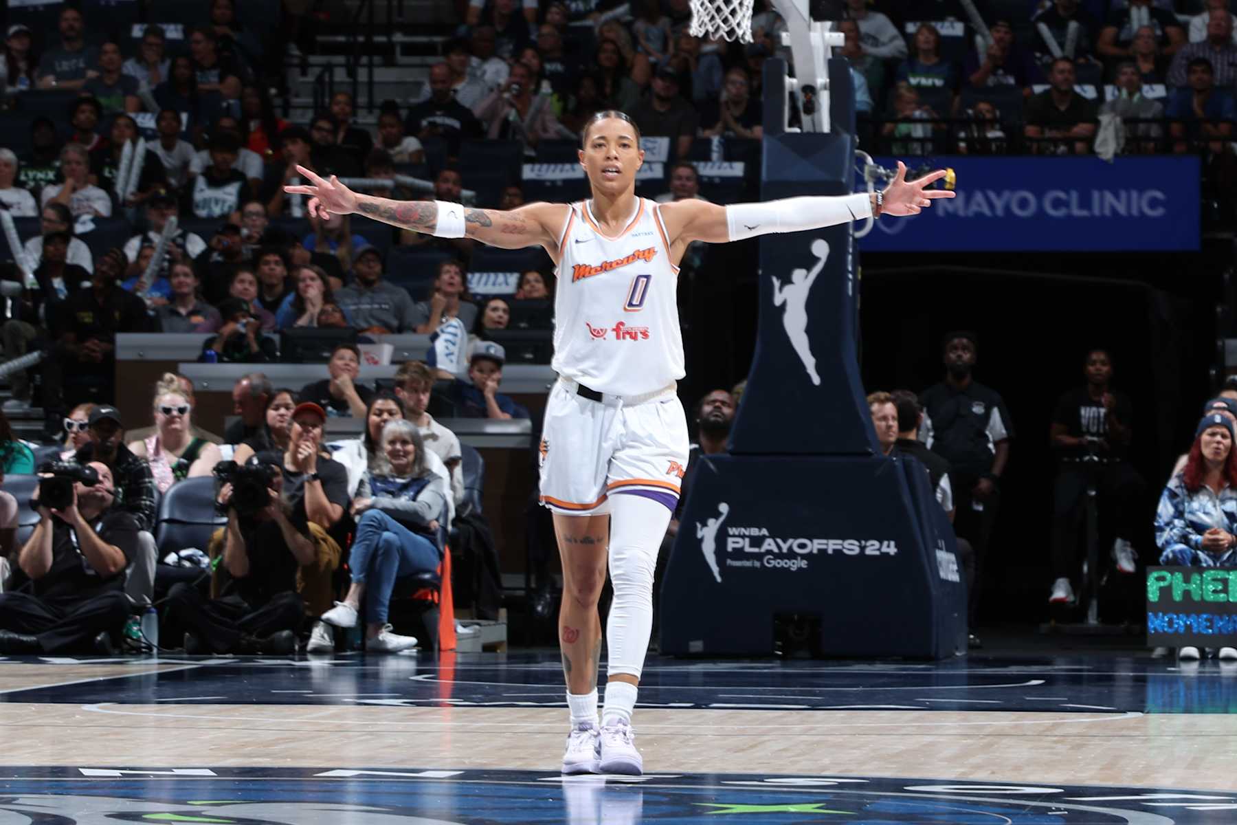 MINNEAPOLIS, MN - SEPTEMBER 22: Natasha Cloud #0 of the Phoenix Mercury celebrates during the game against the Minnesota Lynx during round one game one of the 2024 WNBA Playoffs on September 22, 2024 at Target Center in Minneapolis, Minnesota. NOTE TO USER: User expressly acknowledges and agrees that, by downloading and or using this Photograph, user is consenting to the terms and conditions of the Getty Images License Agreement. Mandatory Copyright Notice: Copyright 2024 NBAE (Photo by David Sherman/NBAE via Getty Images)