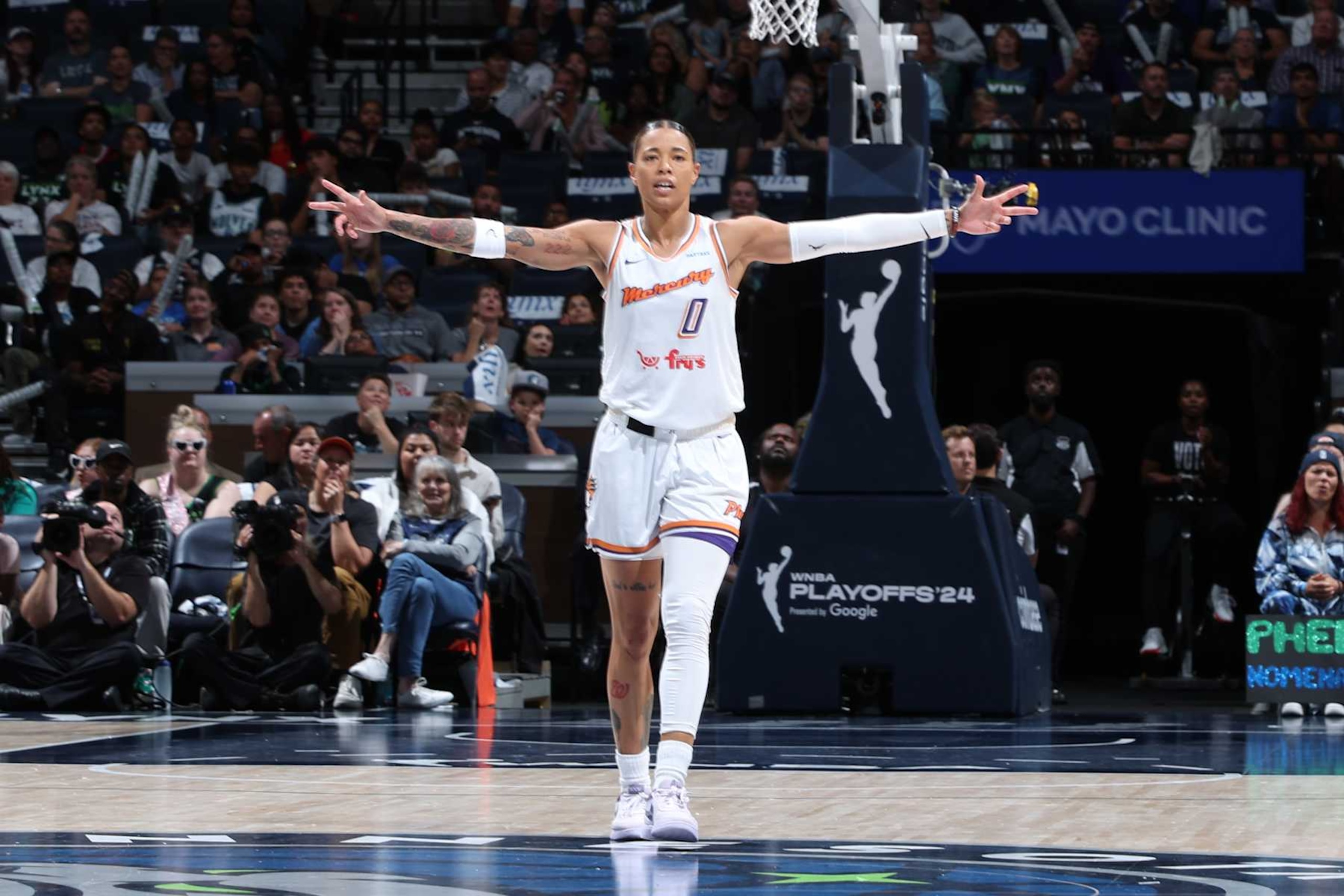 MINNEAPOLIS, MN - SEPTEMBER 22: Natasha Cloud #0 of the Phoenix Mercury celebrates during the game against the Minnesota Lynx during round one game one of the 2024 WNBA Playoffs on September 22, 2024 at Target Center in Minneapolis, Minnesota. NOTE TO USER: User expressly acknowledges and agrees that, by downloading and or using this Photograph, user is consenting to the terms and conditions of the Getty Images License Agreement. Mandatory Copyright Notice: Copyright 2024 NBAE (Photo by David Sherman/NBAE via Getty Images)