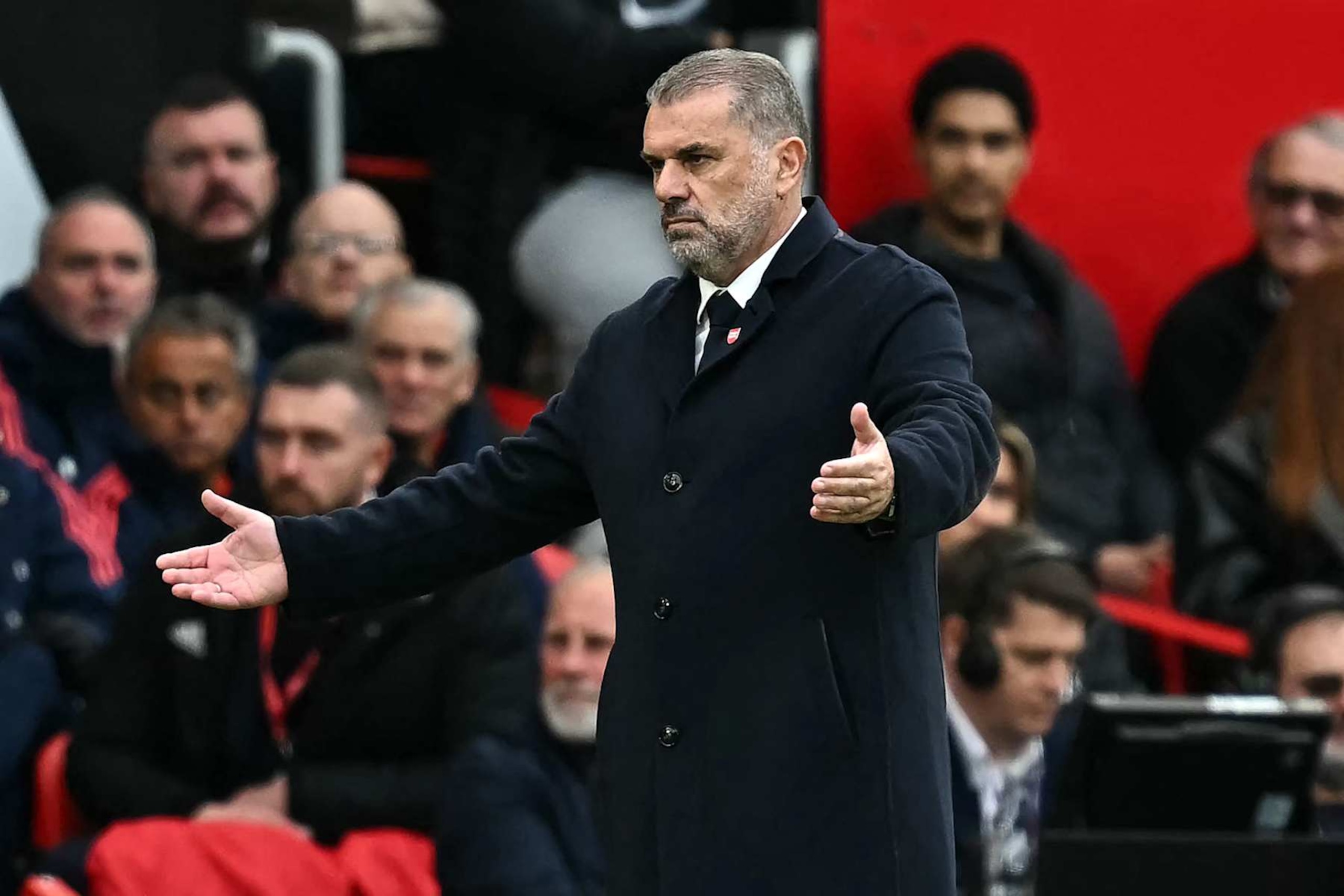 Tottenham Hotspur's Greek-Australian Head Coach Ange Postecoglou reacts on the touchline during the English Premier League football match between Manchester United and Tottenham Hotspur at Old Trafford in Manchester, north west England, on September 29, 2024. (Photo by Paul ELLIS / AFP) / RESTRICTED TO EDITORIAL USE. No use with unauthorized audio, video, data, fixture lists, club/league logos or 'live' services. Online in-match use limited to 120 images. An additional 40 images may be used in extra time. No video emulation. Social media in-match use limited to 120 images. An additional 40 images may be used in extra time. No use in betting publications, games or single club/league/player publications. /  (Photo by PAUL ELLIS/AFP via Getty Images)