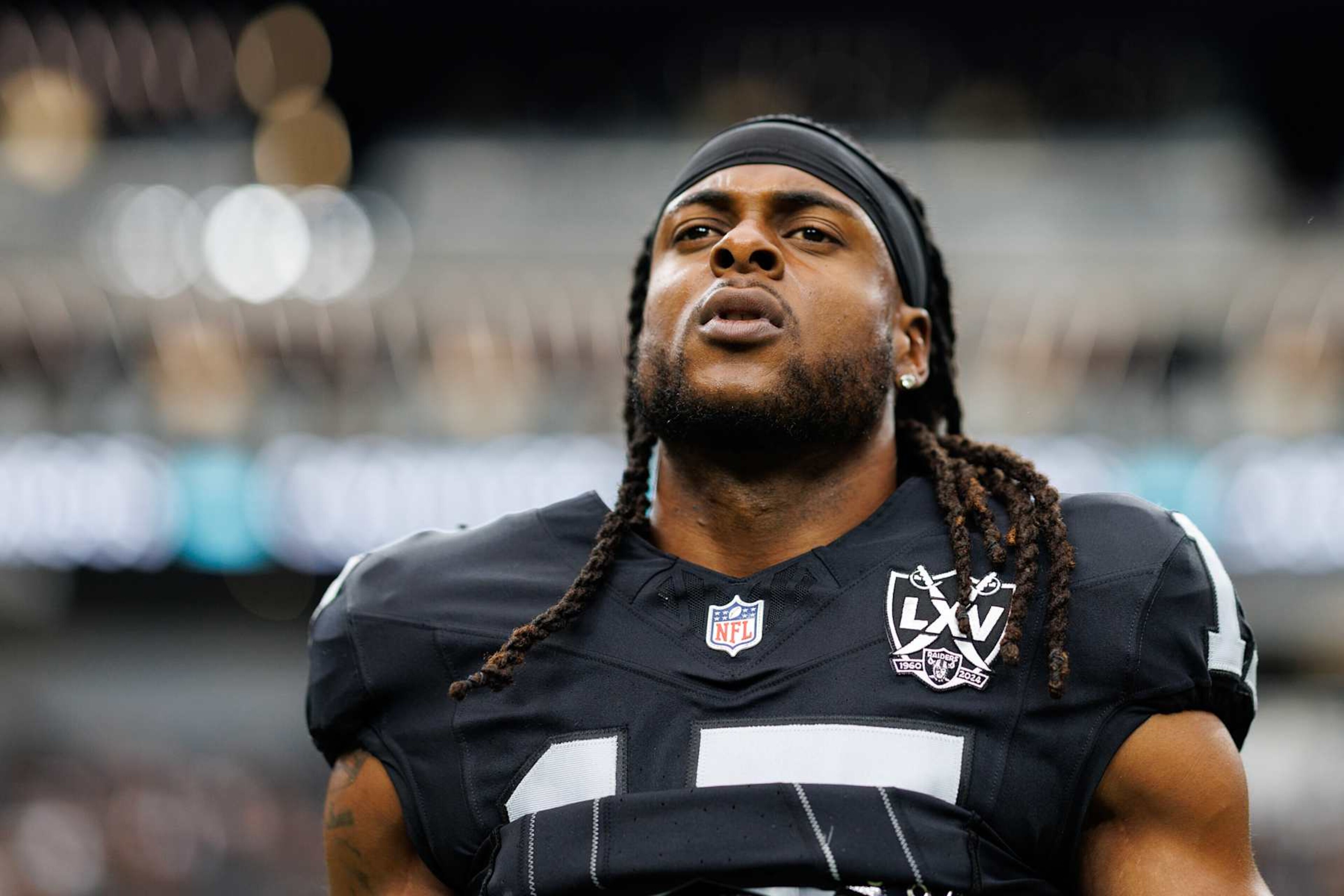 LAS VEGAS, NEVADA - SEPTEMBER 22: Wide receiver Davante Adams #17 of the Las Vegas Raiders stretches prior to an NFL football game against the Carolina Panthers, at Allegiant Stadium on September 22, 2024 in Las Vegas, Nevada. (Photo by Brooke Sutton/Getty Images) LAS VEGAS, NEVADA - SEPTEMBER 22: Wide receiver Davante Adams #17 of the Las Vegas Raiders stretches prior to an NFL football game against the Carolina Panthers, at Allegiant Stadium on September 22, 2024 in Las Vegas, Nevada. (Photo by Brooke Sutton/Getty Images)
