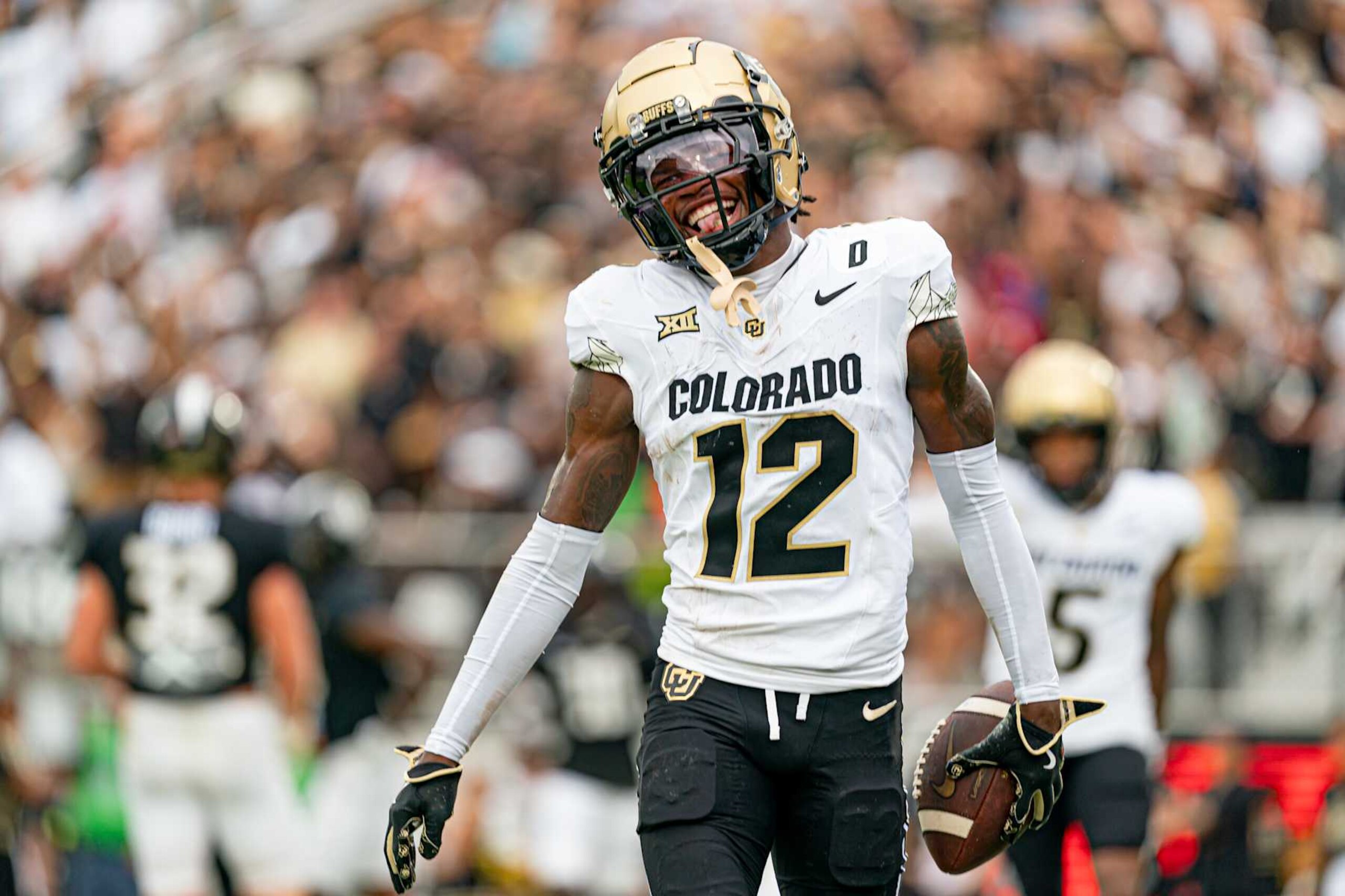 ORLANDO, FL - SEPTEMBER 28:Colorado Buffaloes wide receiver Travis Hunter (12) smiles after a touchdown during a college football game between the Colorado Buffaloes and the UCF Knights on September 28th, 2024 at FBC Mortgage Stadium in Orlando, FL. (Photo by Chris Leduc/Icon Sportswire via Getty Images) ORLANDO, FL - SEPTEMBER 28:Colorado Buffaloes wide receiver Travis Hunter (12) smiles after a touchdown during a college football game between the Colorado Buffaloes and the UCF Knights on September 28th, 2024 at FBC Mortgage Stadium in Orlando, FL. (Photo by Chris Leduc/Icon Sportswire via Getty Images)