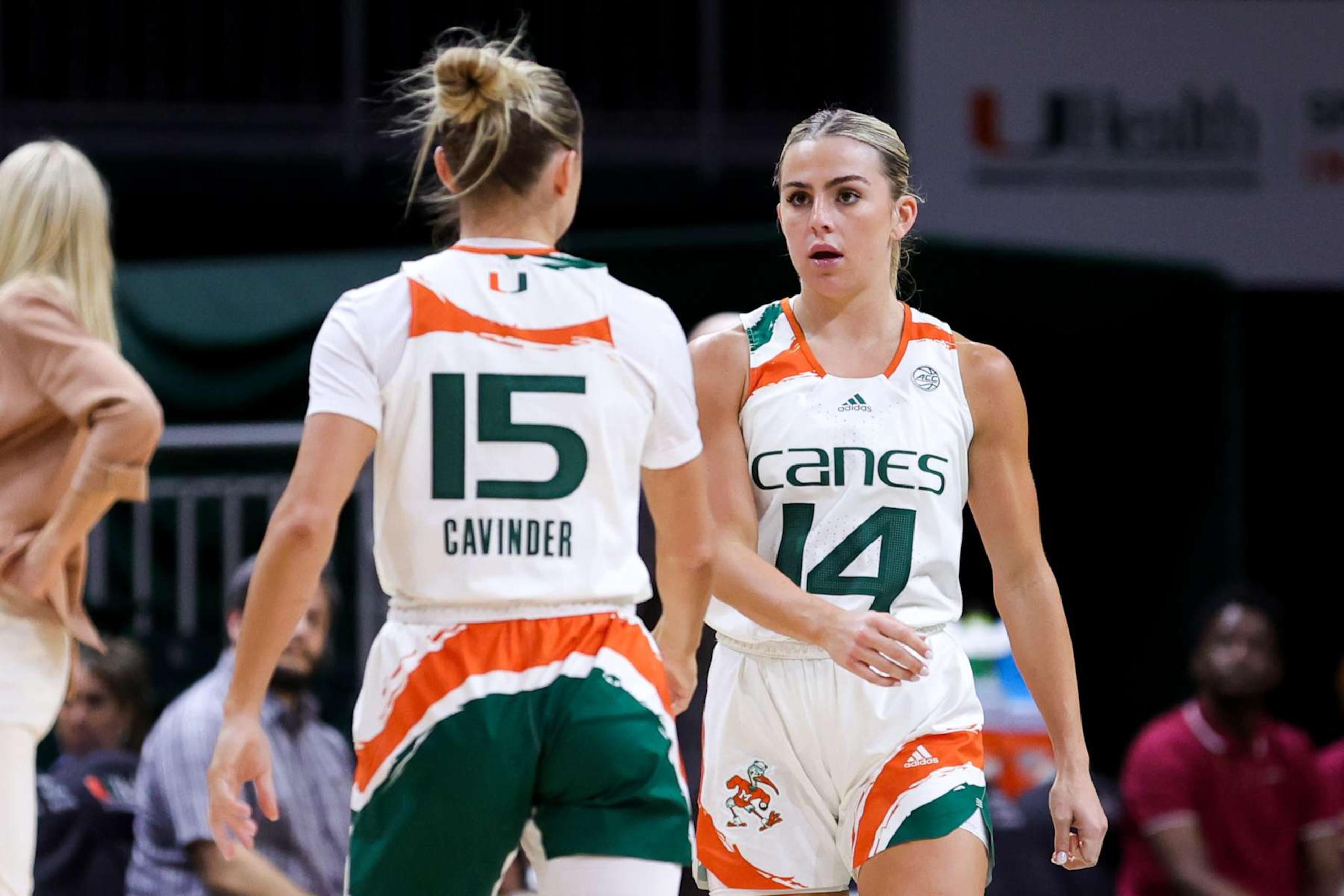 CORAL GABLES, FLORIDA - FEBRUARY 09: Hanna Cavinder #15 and Haley Cavinder #14 of the Miami Hurricanes talk on the court during the second quarter of the game against the Florida State Seminoles at Watsco Center on February 09, 2023 in Coral Gables, Florida. (Photo by Megan Briggs/Getty Images) CORAL GABLES, FLORIDA - FEBRUARY 09: Hanna Cavinder #15 and Haley Cavinder #14 of the Miami Hurricanes talk on the court during the second quarter of the game against the Florida State Seminoles at Watsco Center on February 09, 2023 in Coral Gables, Florida. (Photo by Megan Briggs/Getty Images)