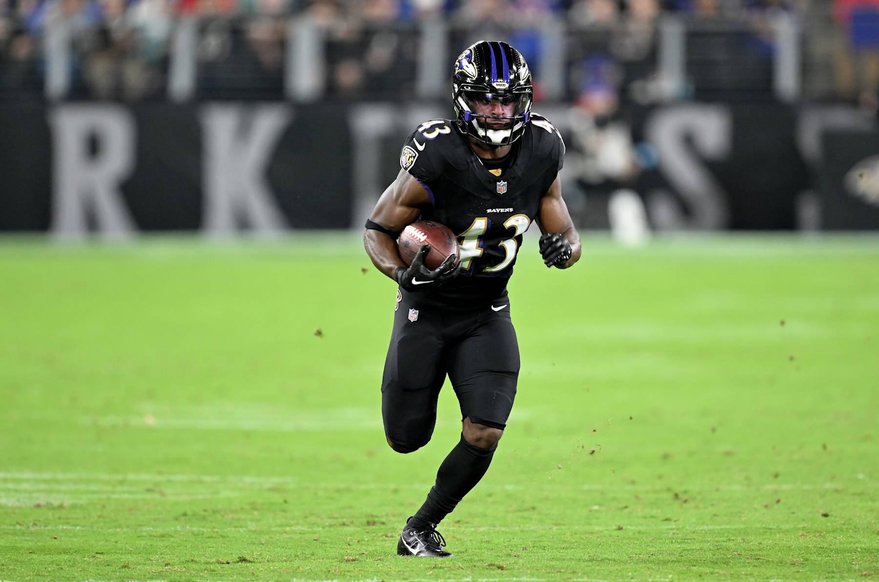 BALTIMORE, MARYLAND - SEPTEMBER 29: Justice Hill #43 of the Baltimore Ravens runs with the ball against the Buffalo Bills at M&T Bank Stadium on September 29, 2024 in Baltimore, Maryland. (Photo by G Fiume/Getty Images)