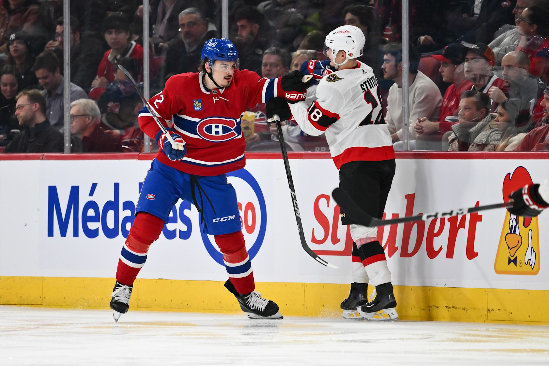 MONTREAL, CANADA - JANUARY 23:  Arber Xhekaj #72 of the Montreal Canadiens holds back Tim Stutzle #18 of the Ottawa Senators during the second period at the Bell Centre on January 23, 2024 in Montreal, Quebec, Canada.  (Photo by Minas Panagiotakis/Getty Images)