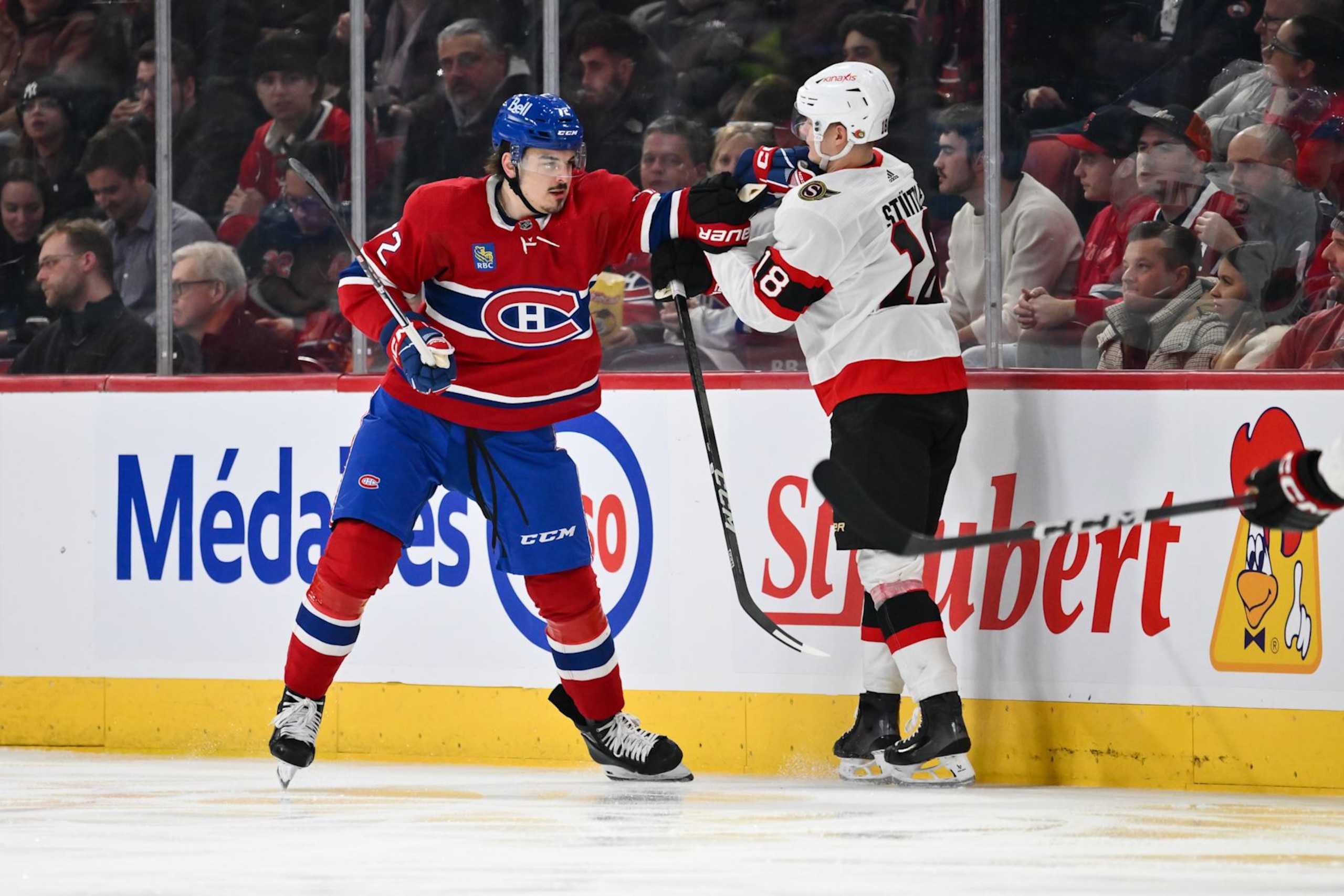 MONTREAL, CANADA - JANUARY 23:  Arber Xhekaj #72 of the Montreal Canadiens holds back Tim Stutzle #18 of the Ottawa Senators during the second period at the Bell Centre on January 23, 2024 in Montreal, Quebec, Canada.  (Photo by Minas Panagiotakis/Getty Images)