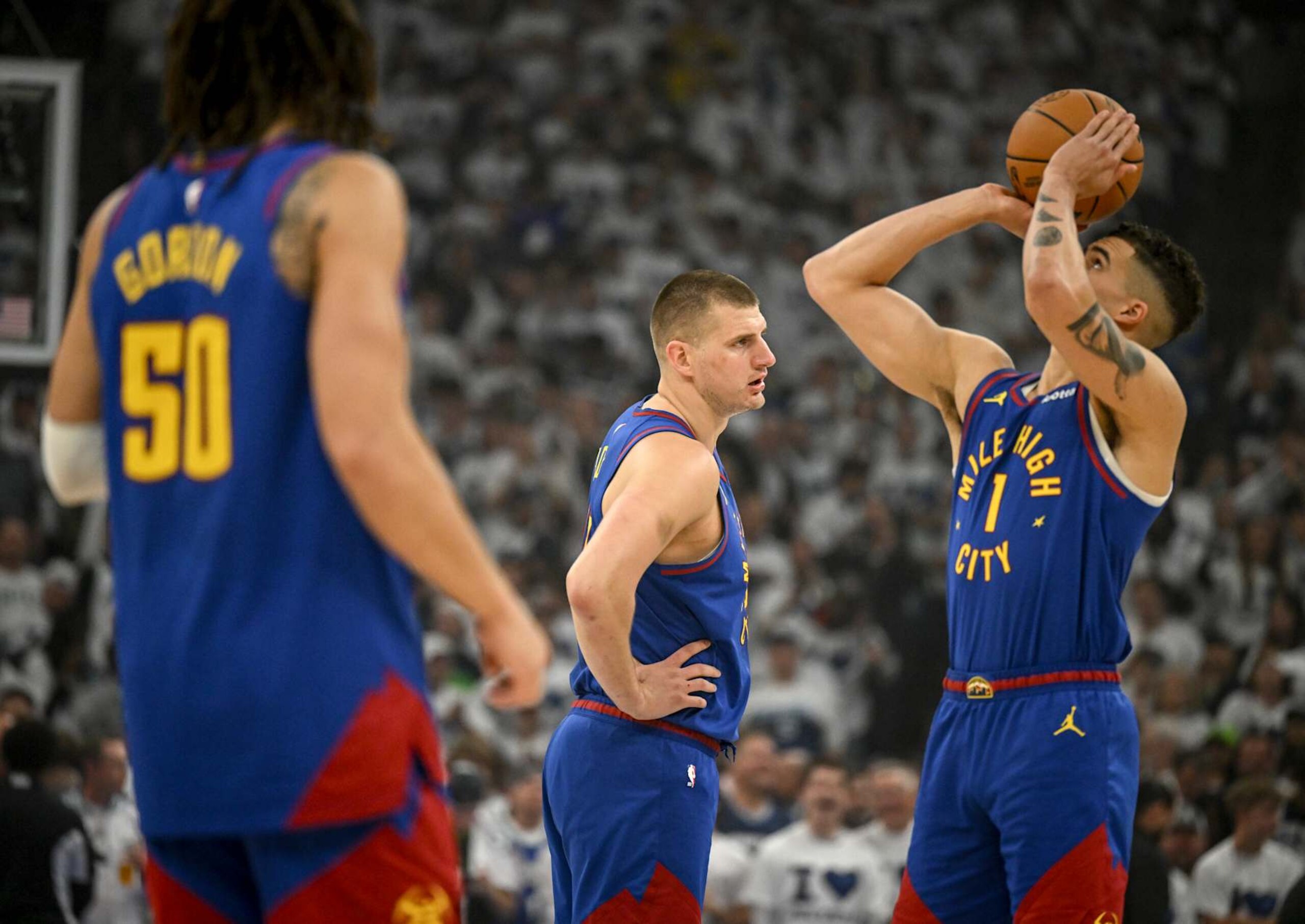 MINNEAPOLIS, MN - MAY 16: Aaron Gordon (50), Nikola Jokic (15) and Michael Porter Jr. (1) of the Denver Nuggets take the floor to face the Minnesota Timberwolves during the first quarter at Target Center in Minneapolis on Thursday, May 16, 2024. (Photo by AAron Ontiveroz/The Denver Post)