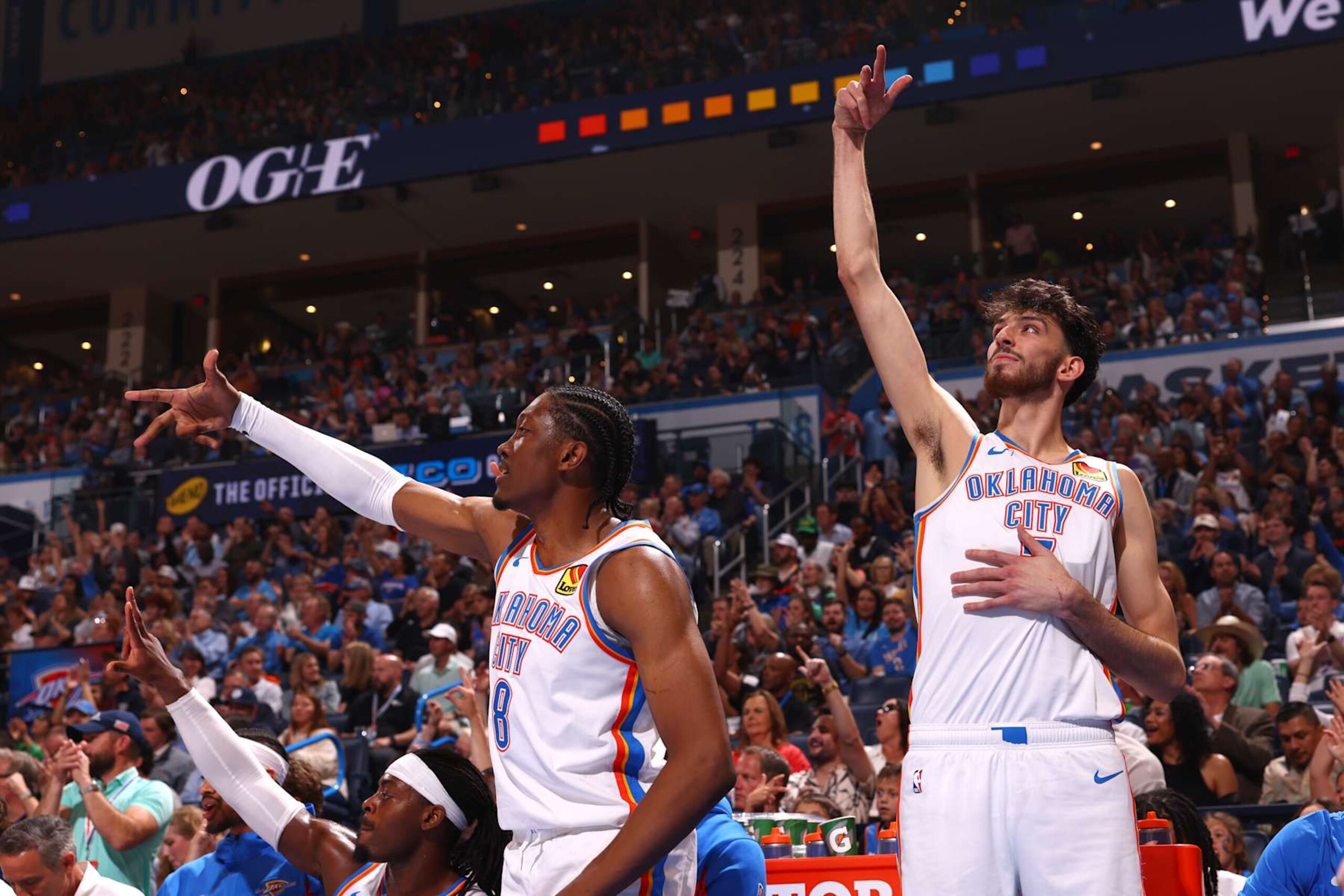 OKLAHOMA CITY, OK - APRIL 12: Jalen Williams #8 of the Oklahoma City Thunder and Chet Holmgren #7 of the Oklahoma City Thunder celebrate during the game against the Milwaukee Bucks on April 12, 2024 at Paycom Arena in Oklahoma City, Oklahoma. NOTE TO USER: User expressly acknowledges and agrees that, by downloading and or using this photograph, User is consenting to the terms and conditions of the Getty Images License Agreement. Mandatory Copyright Notice: Copyright 2024 NBAE (Photo by Zach Beeker/NBAE via Getty Images)